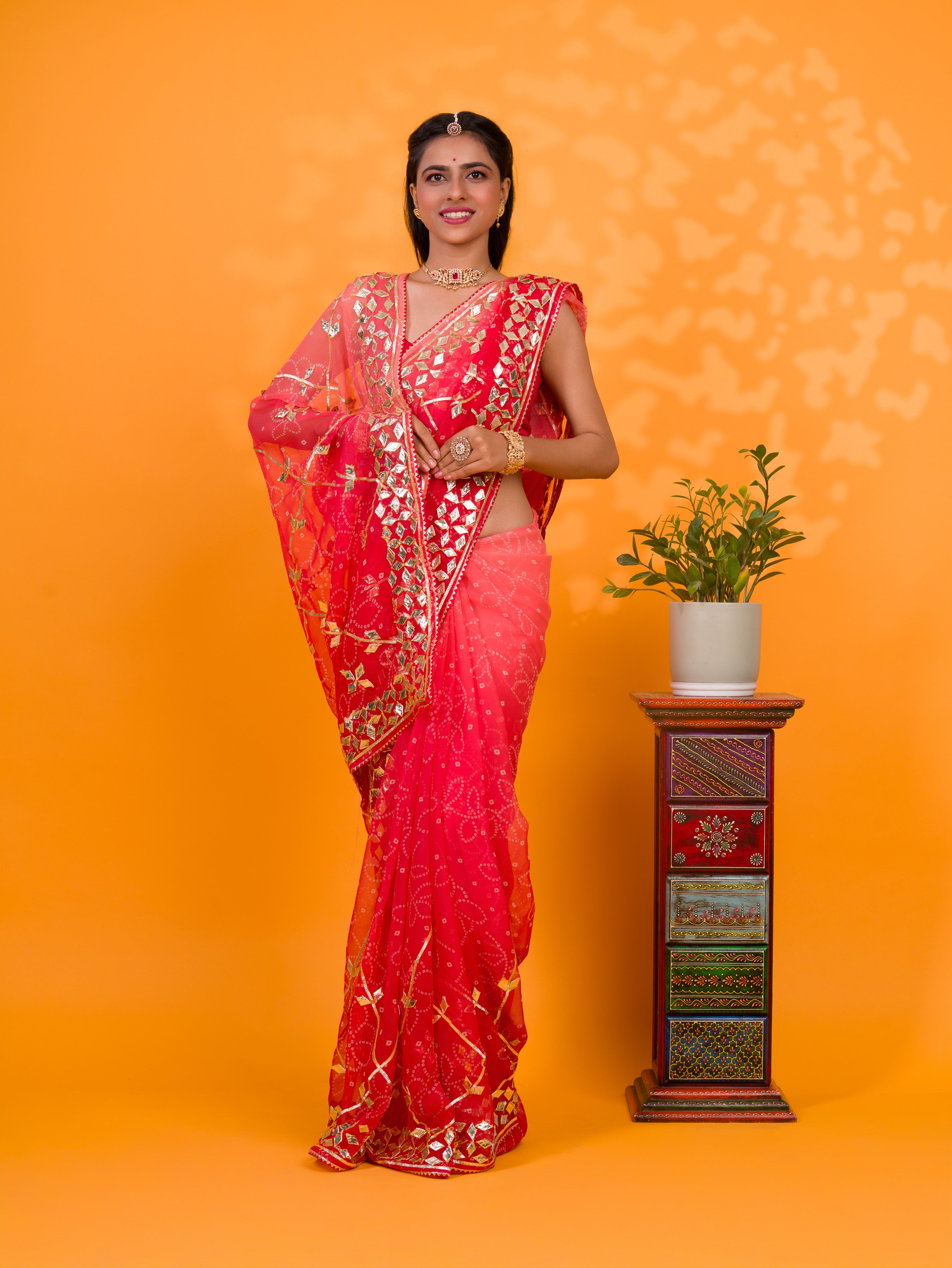 Bright red saree with gold patternsChiffon Bandhani Style With Gotapatti Work Saree