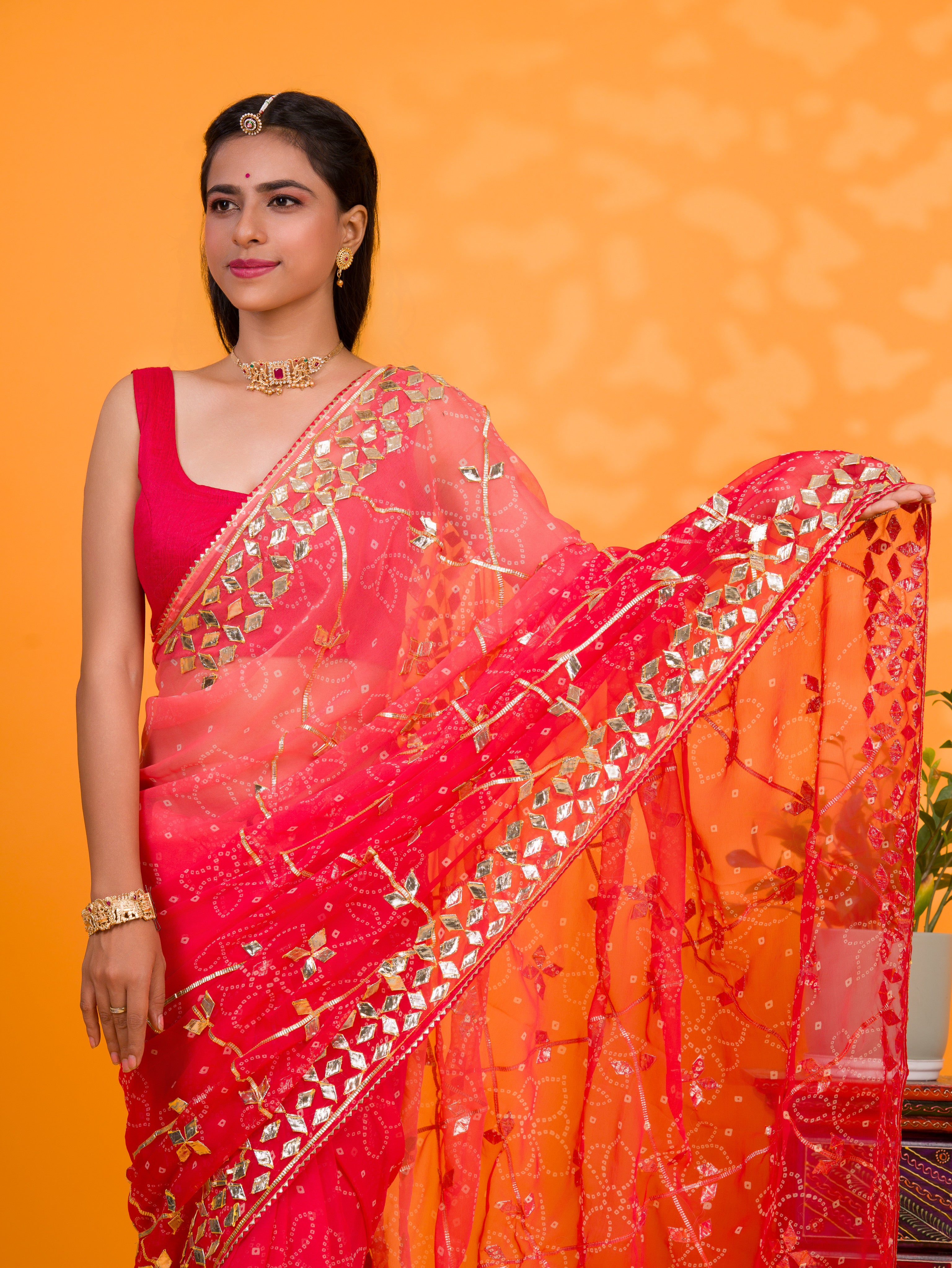 Bright red saree with gold patternsChiffon Bandhani Style With Gotapatti Work Saree