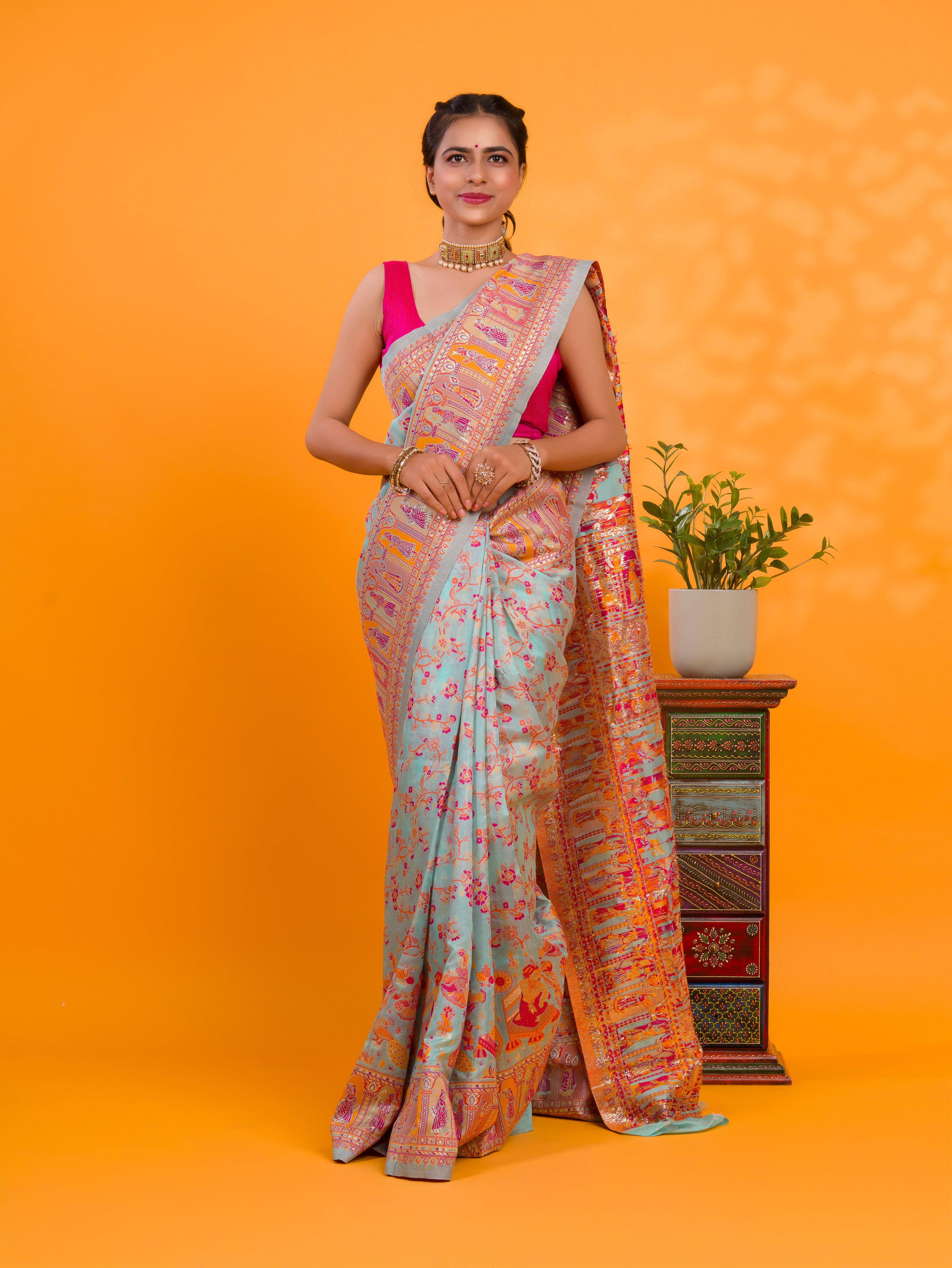 A orenge cotton silk saree with Kashmiri style patterns and Meenakari weaving work.