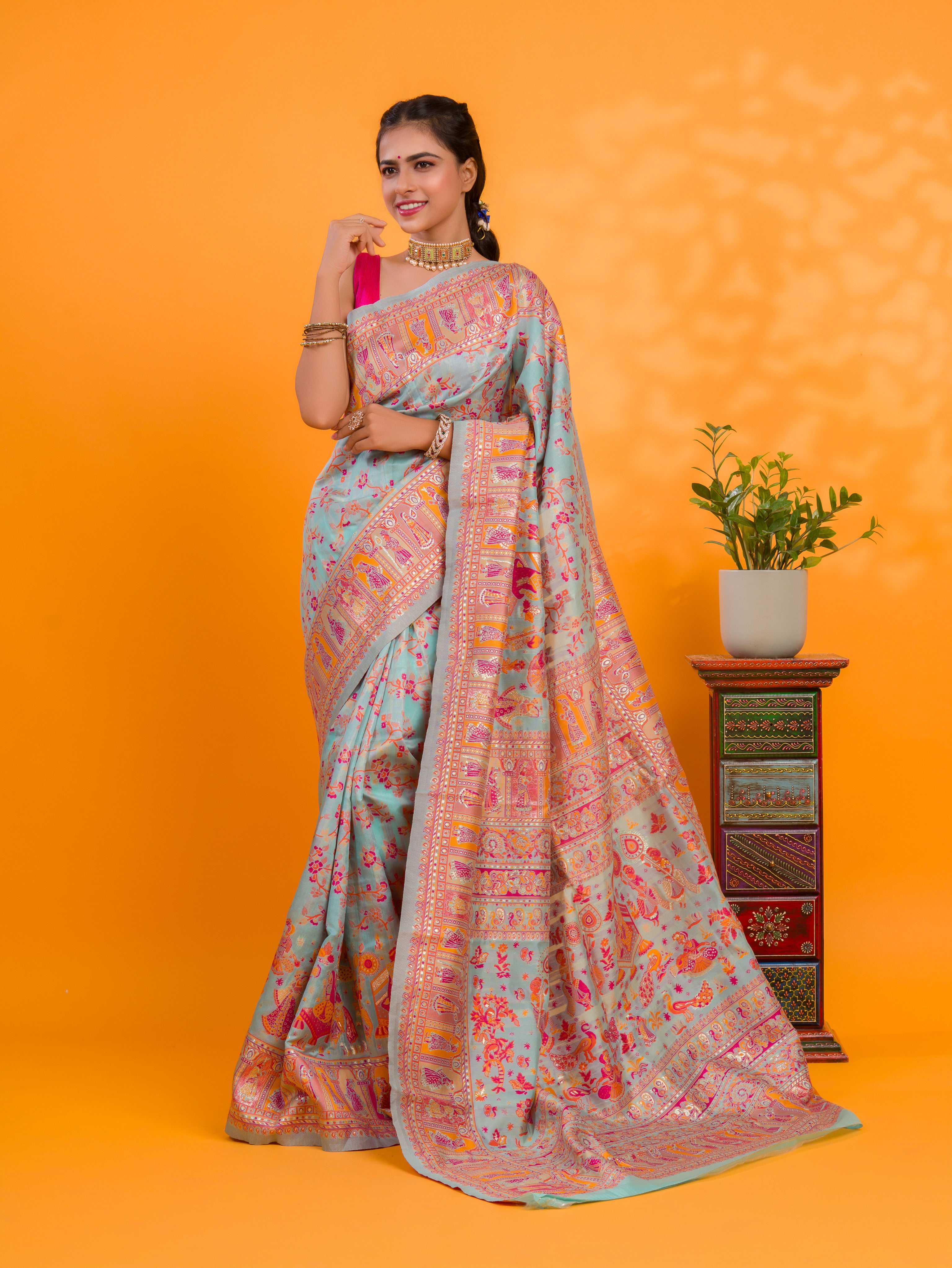A orenge cotton silk saree with Kashmiri style patterns and Meenakari weaving work.