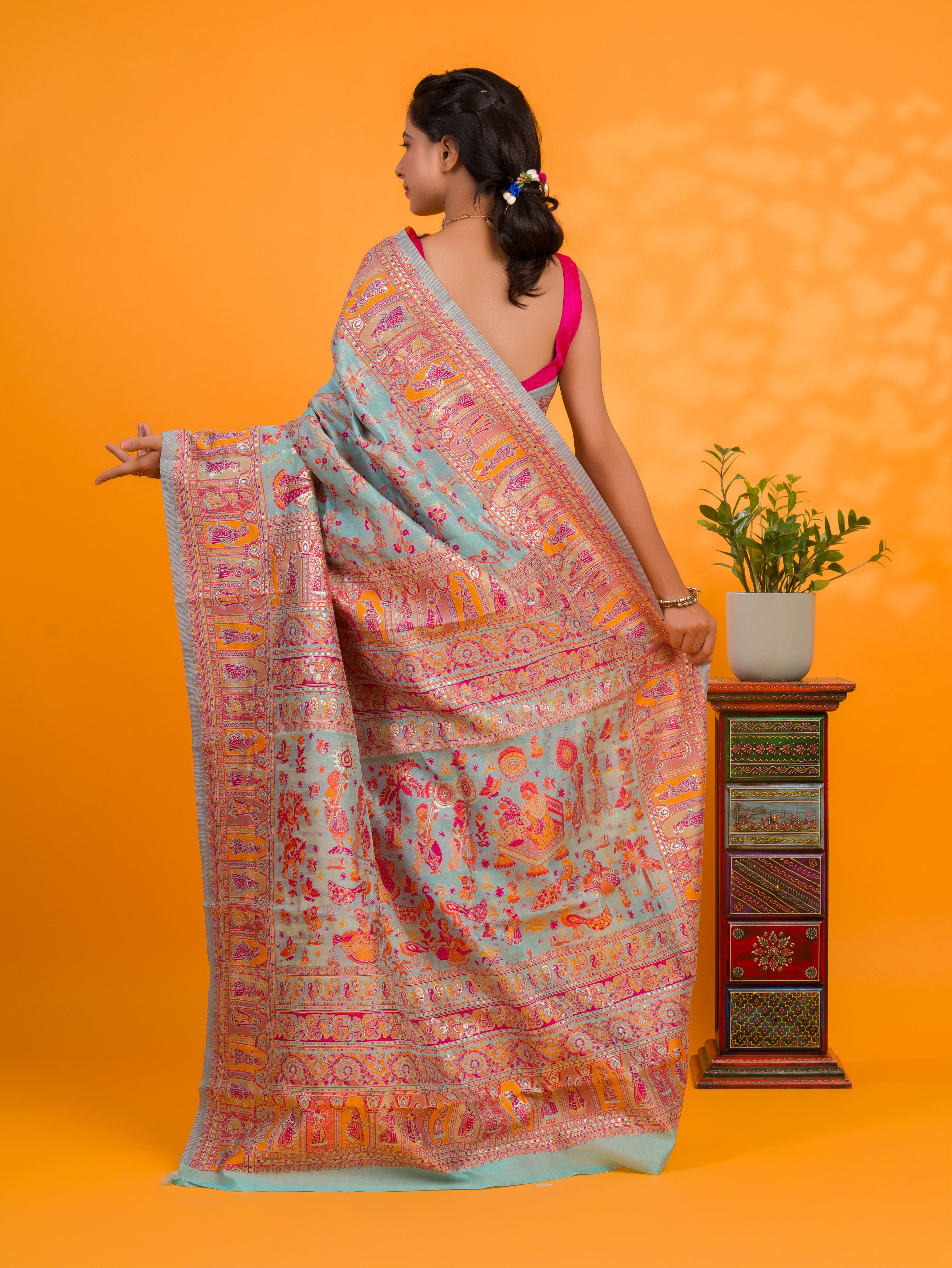 A orenge cotton silk saree with Kashmiri style patterns and Meenakari weaving work.