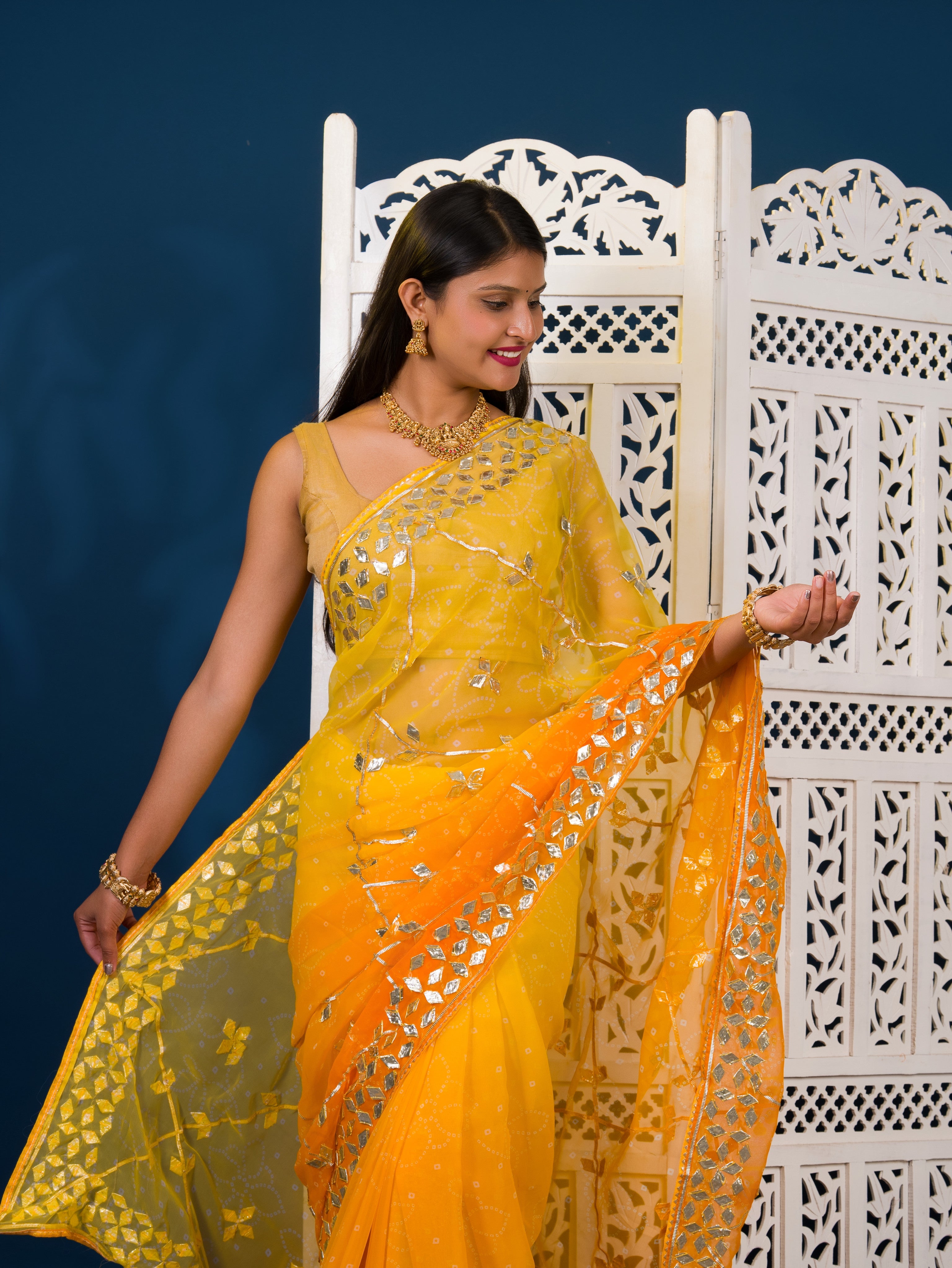 Yellow saree with white patternsChiffon Bandhani Style With Gotapatti Work Saree