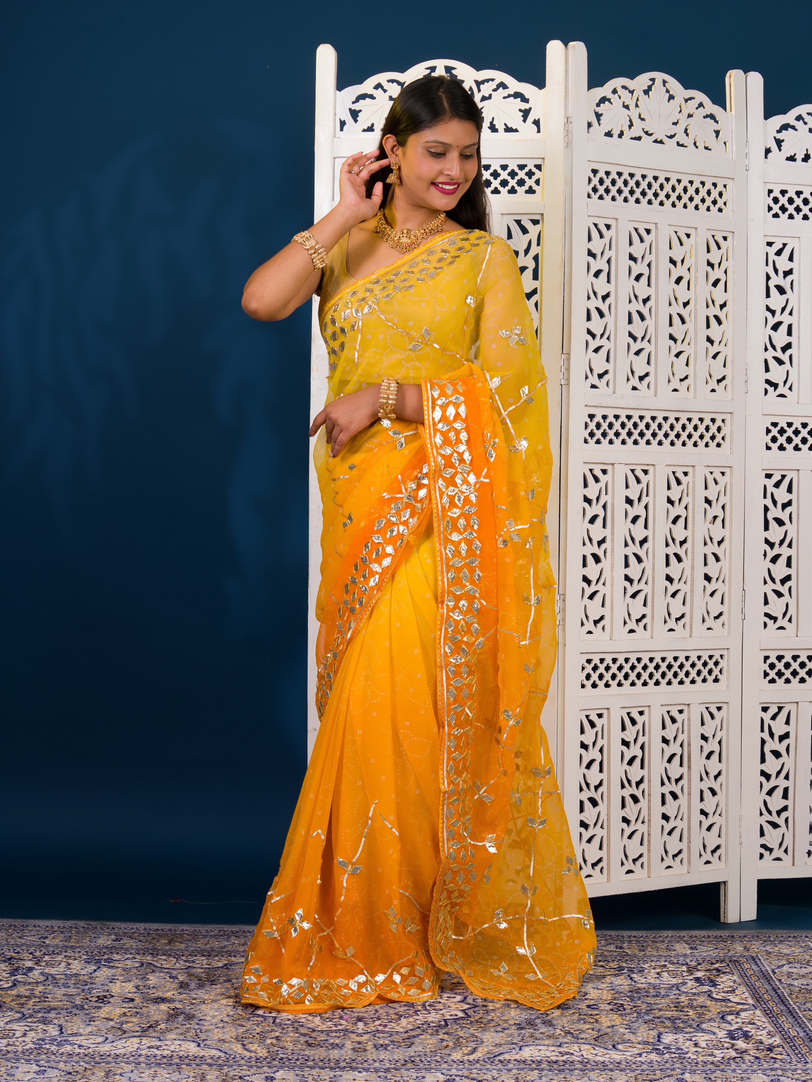Yellow saree with white patternsChiffon Bandhani Style With Gotapatti Work Saree