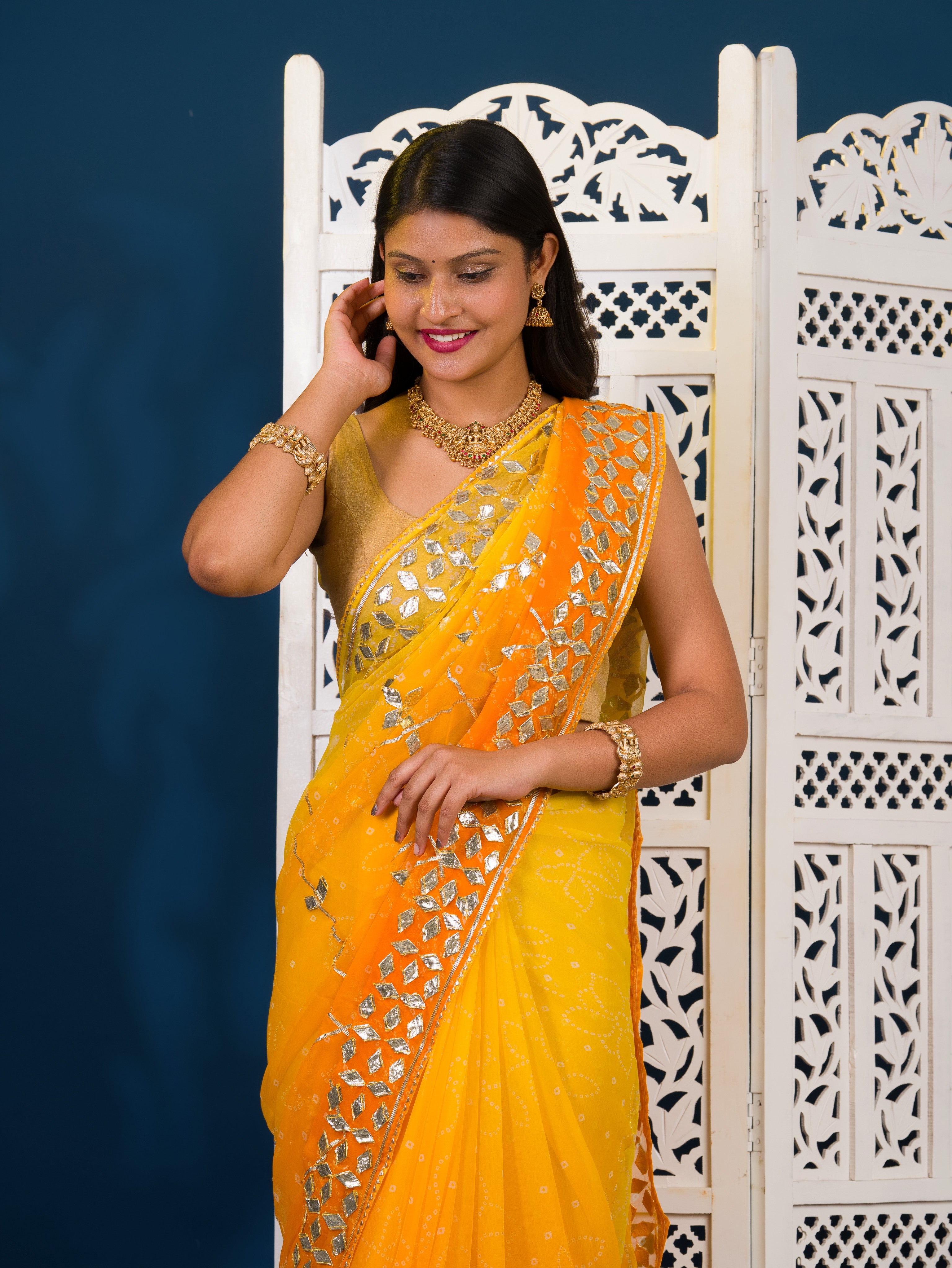 Yellow saree with white patternsChiffon Bandhani Style With Gotapatti Work Saree