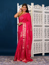 A pink and gold Upada silk saree with Bandhani style embellishments and Zari work,
