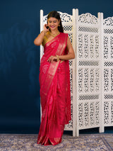 A pink and gold Upada silk saree with Bandhani style embellishments and Zari work,
