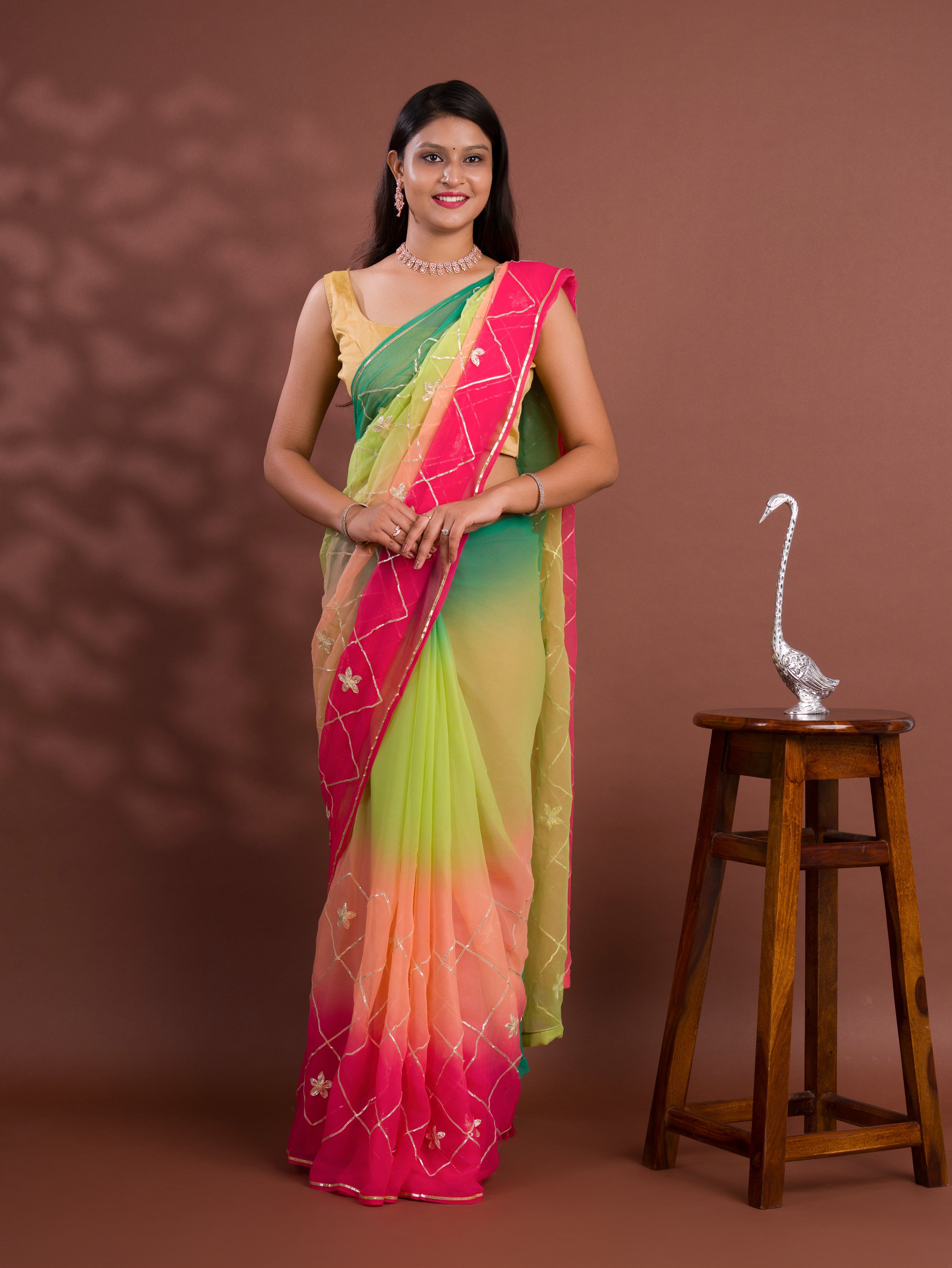 A green and pink saree with white gotapati work under 1000
