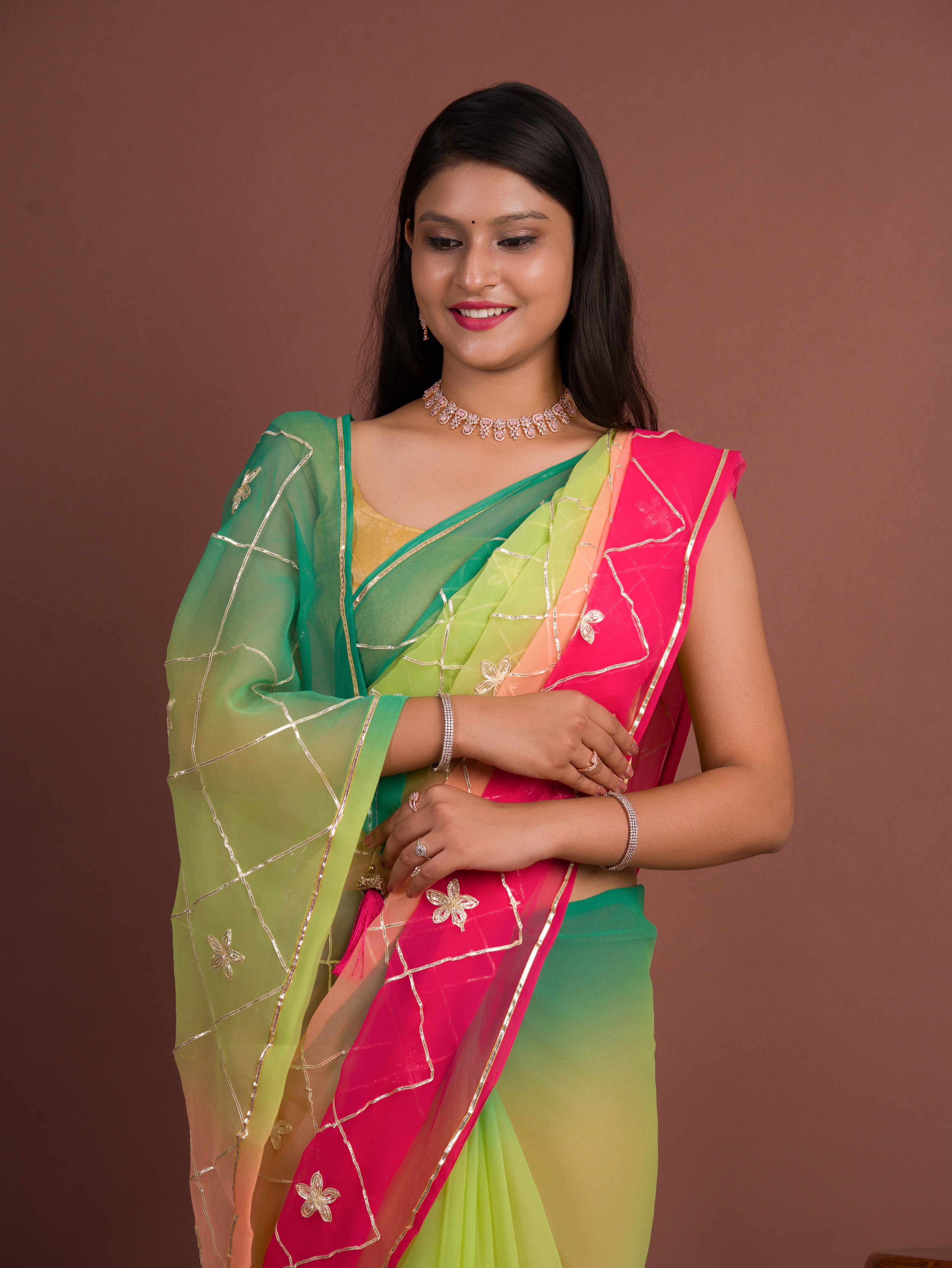 A green and pink saree with white gotapati work under 1000