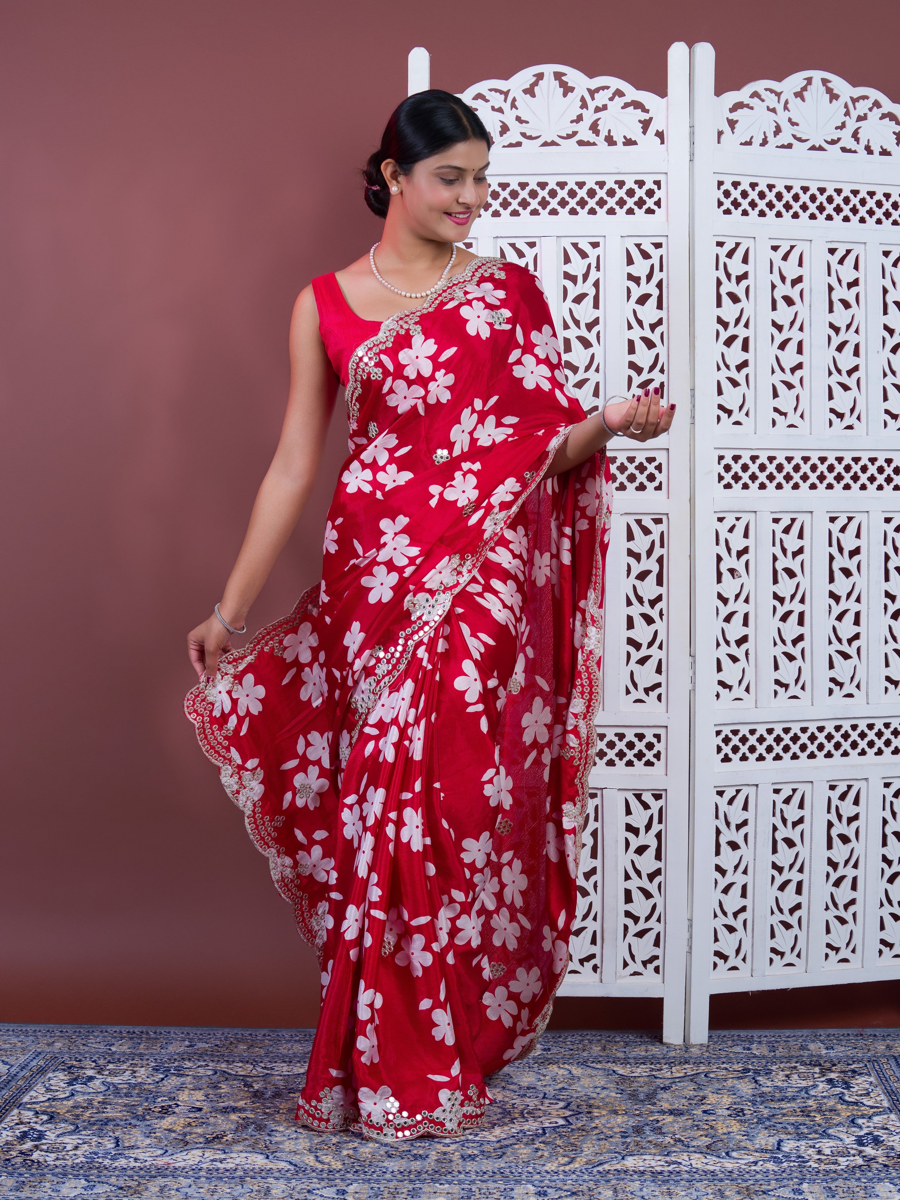 A red saree with white pattern Printed Crepe Silk with Embroidered Mirror Work