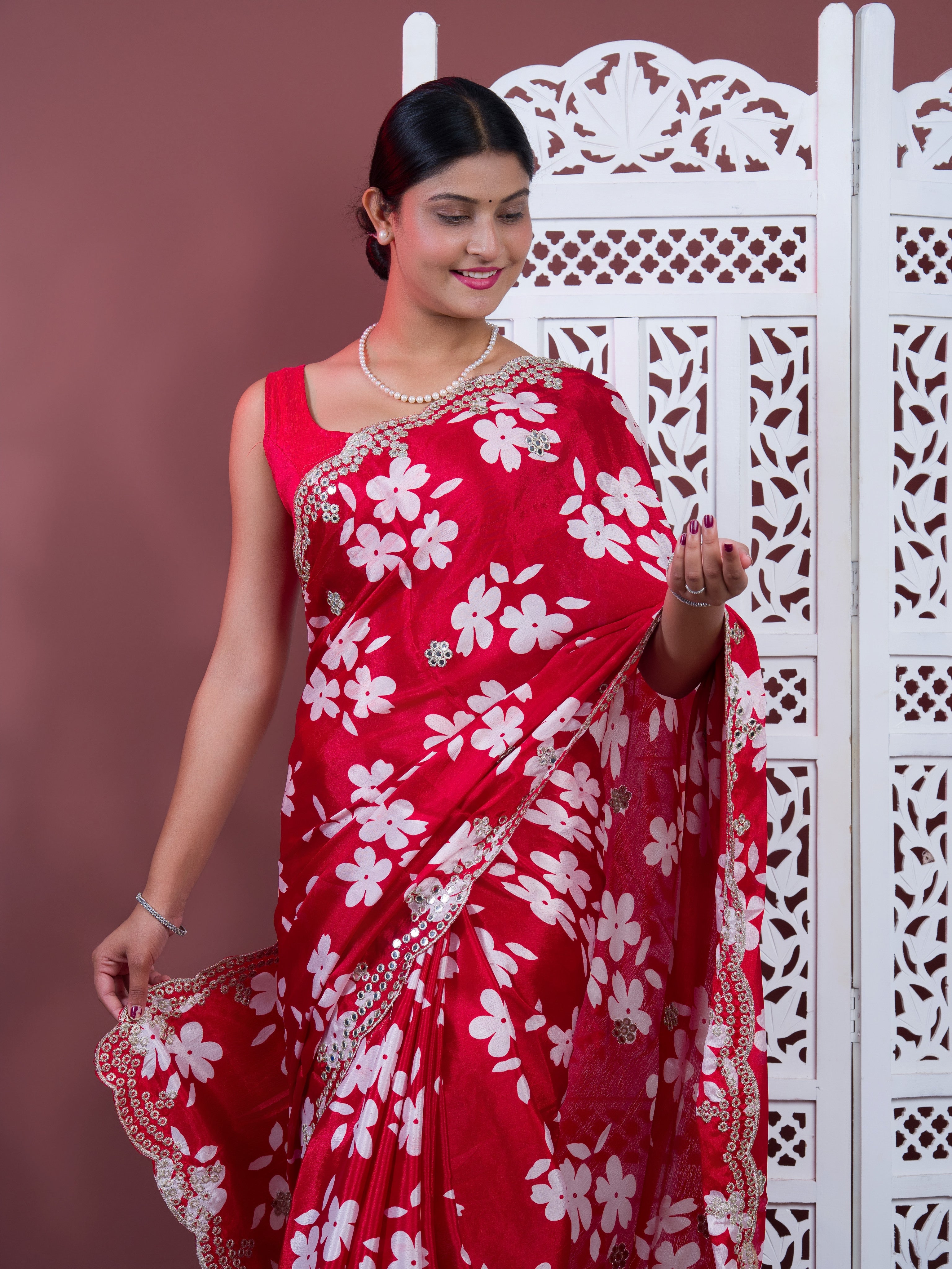 A red saree with white pattern Printed Crepe Silk with Embroidered Mirror Work