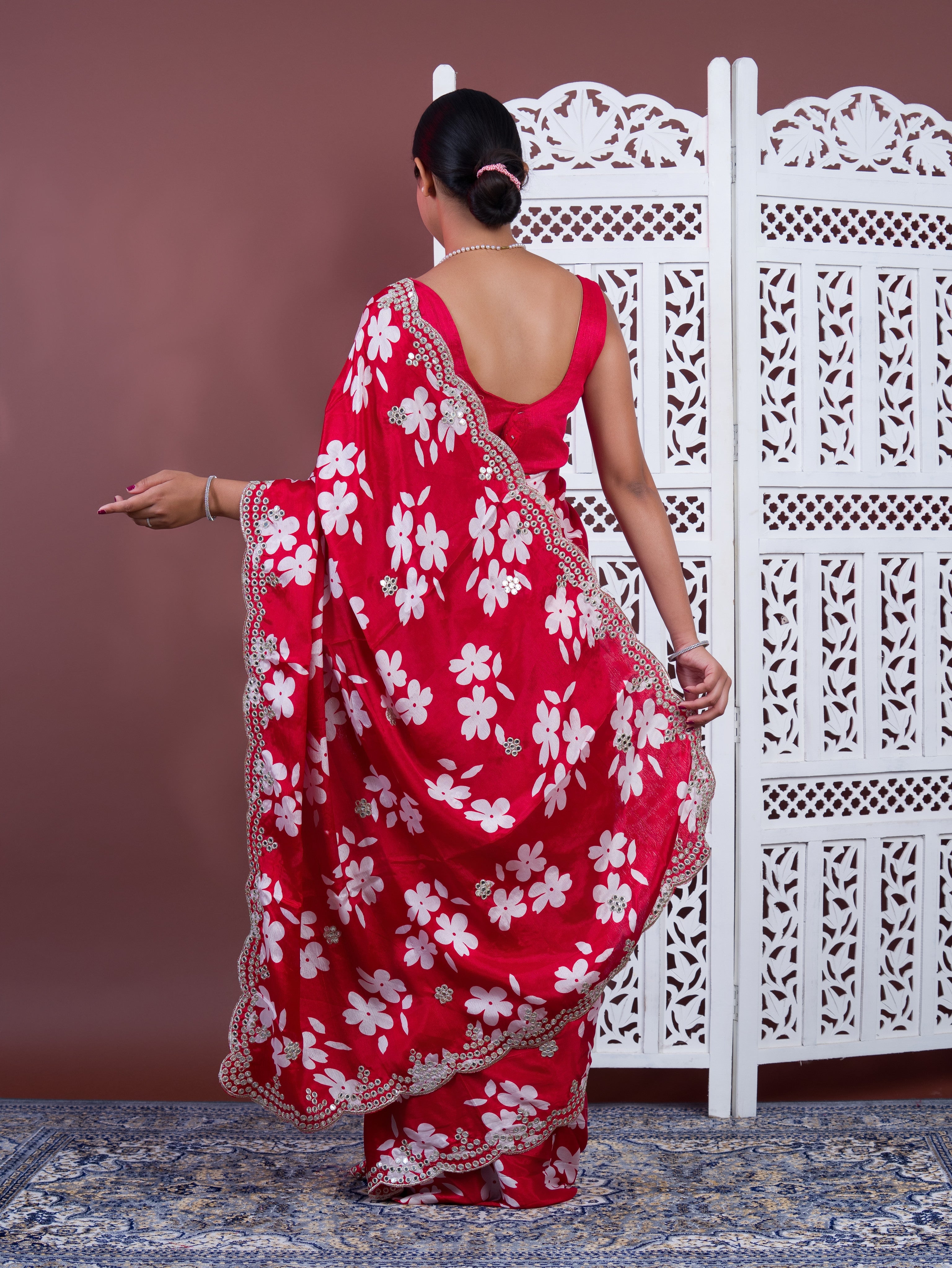 A red saree with white pattern Printed Crepe Silk with Embroidered Mirror Work