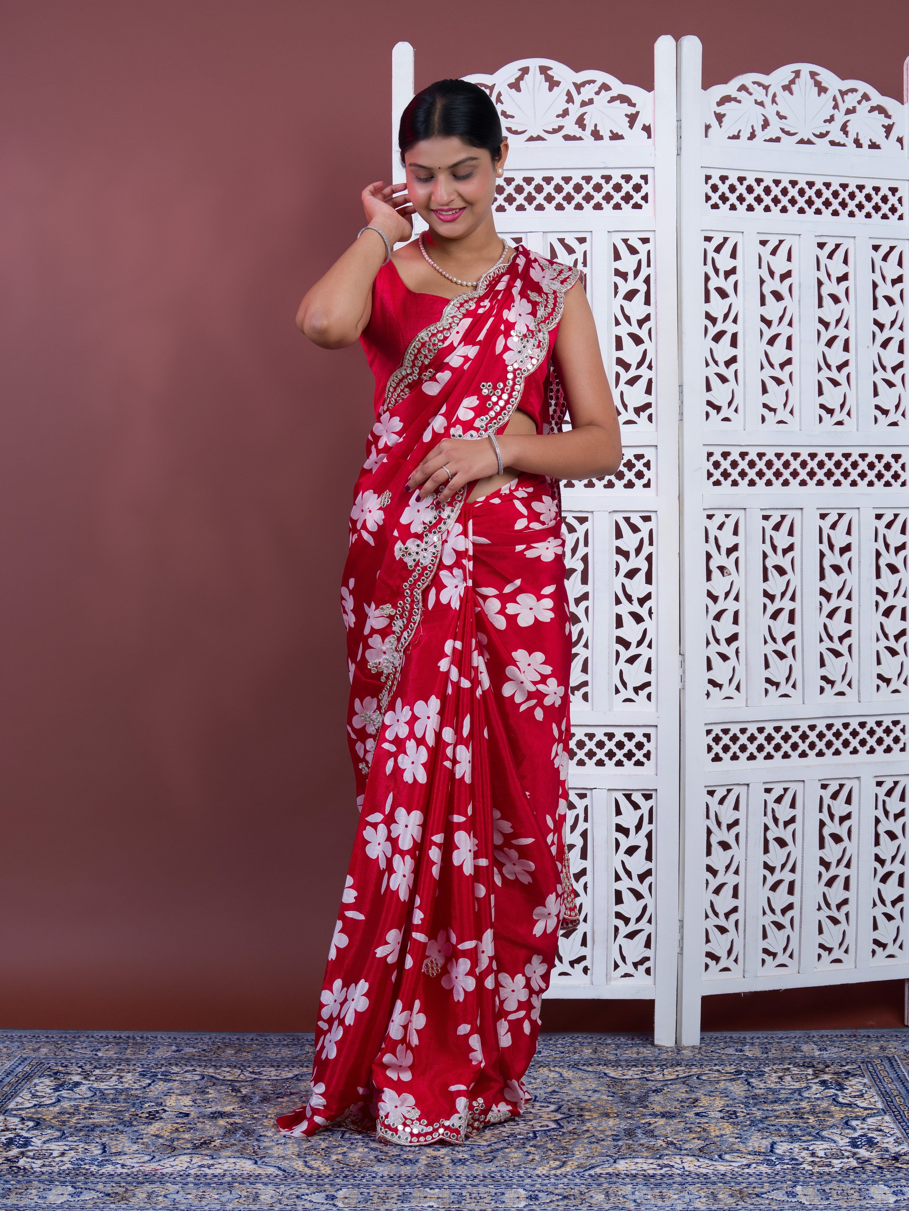A red saree with white pattern Printed Crepe Silk with Embroidered Mirror Work