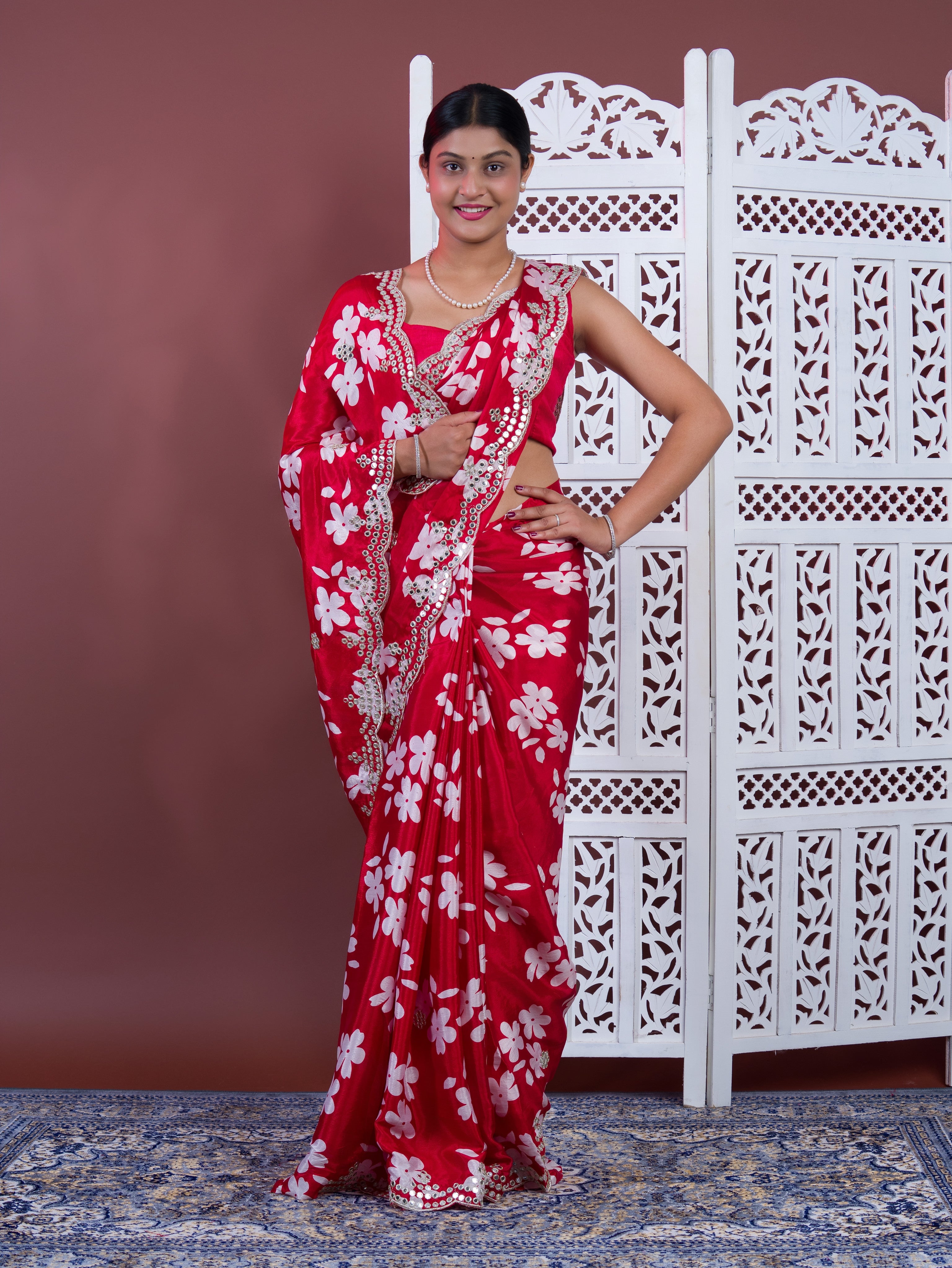 A red saree with white pattern Printed Crepe Silk with Embroidered Mirror Work