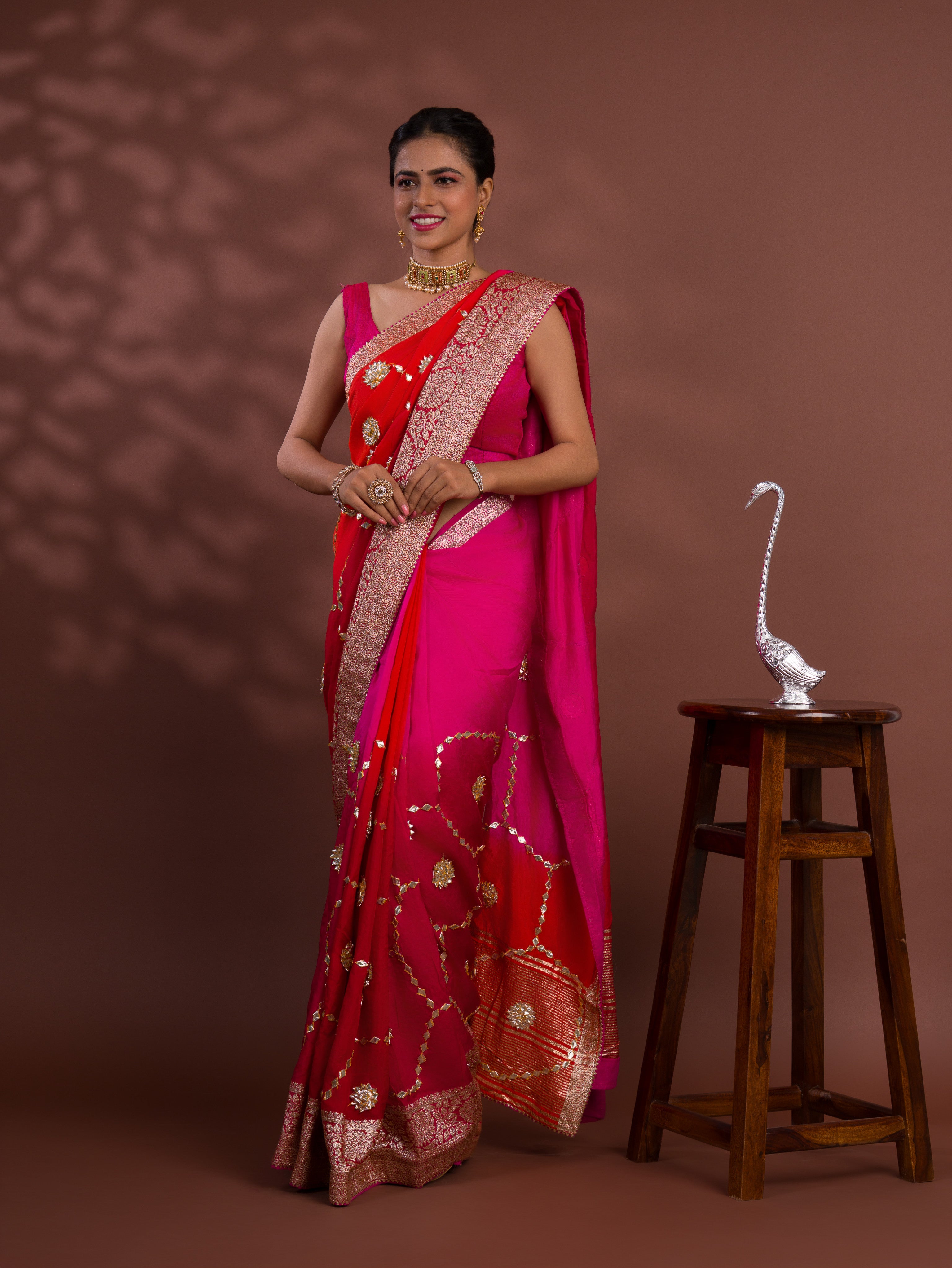 A pink and orange saree with Gota Patti Work