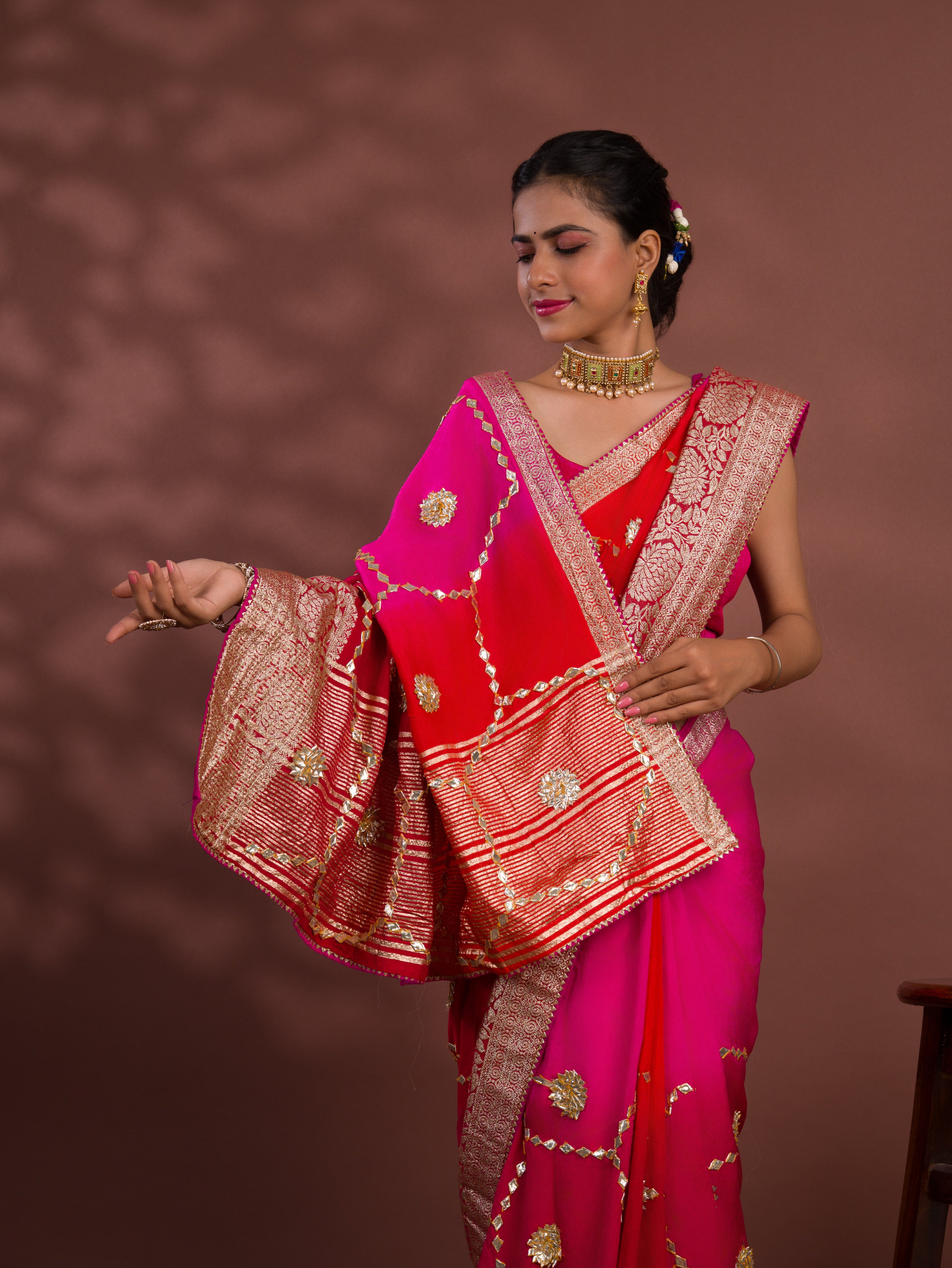 A pink and orange saree with Gota Patti Work