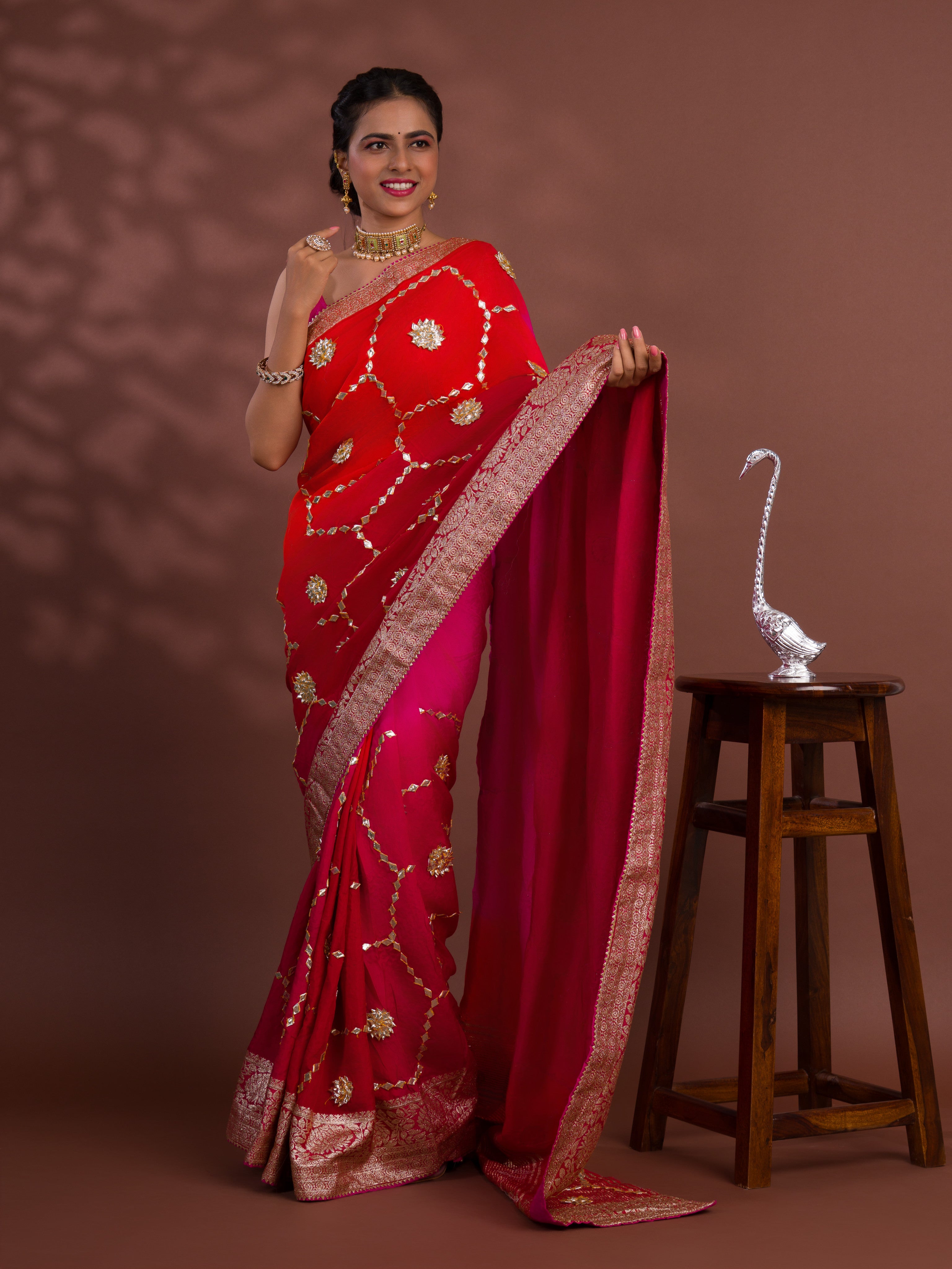 A pink and orange saree with Gota Patti Work