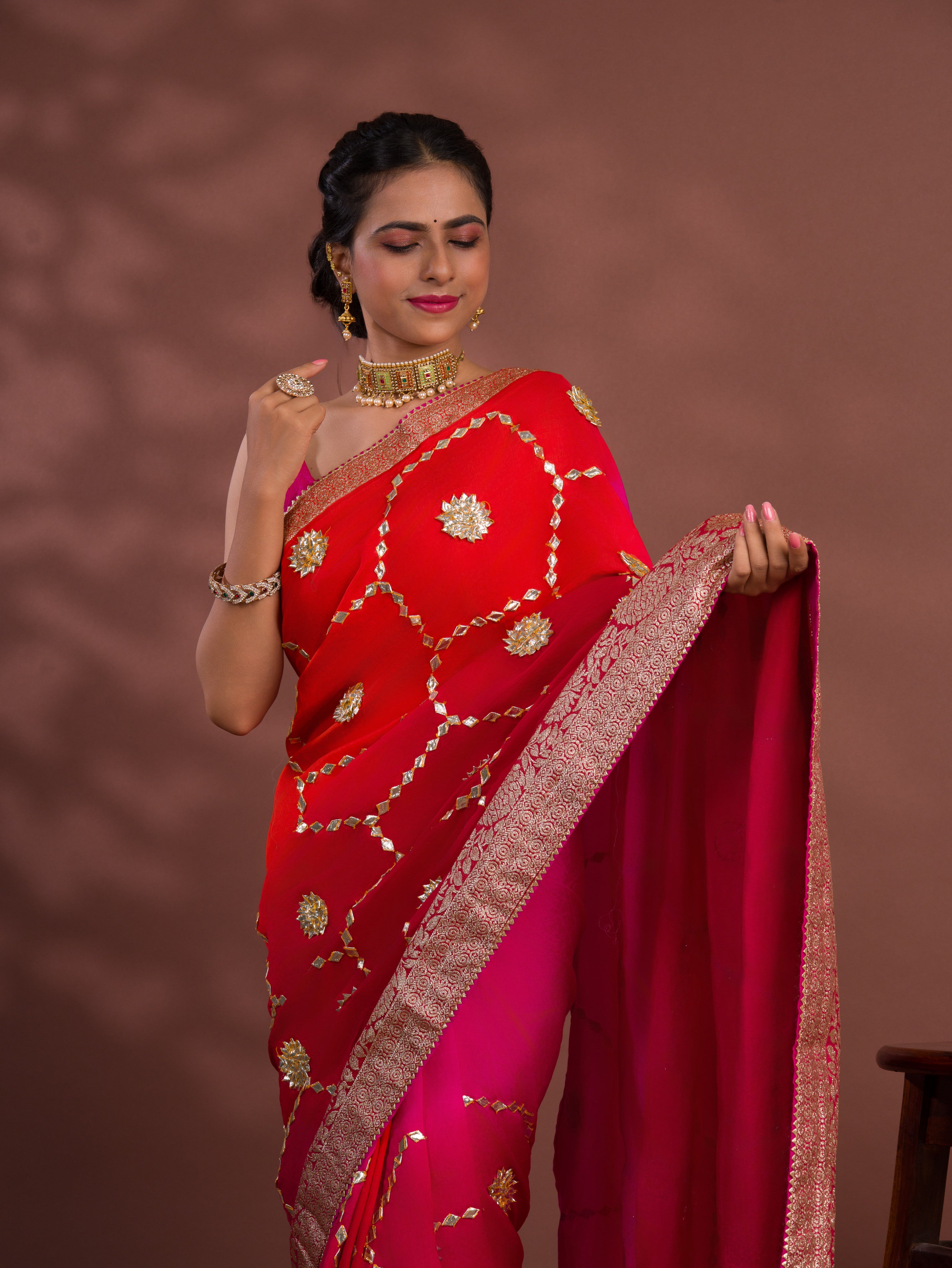 A pink and orange saree with Gota Patti Work
