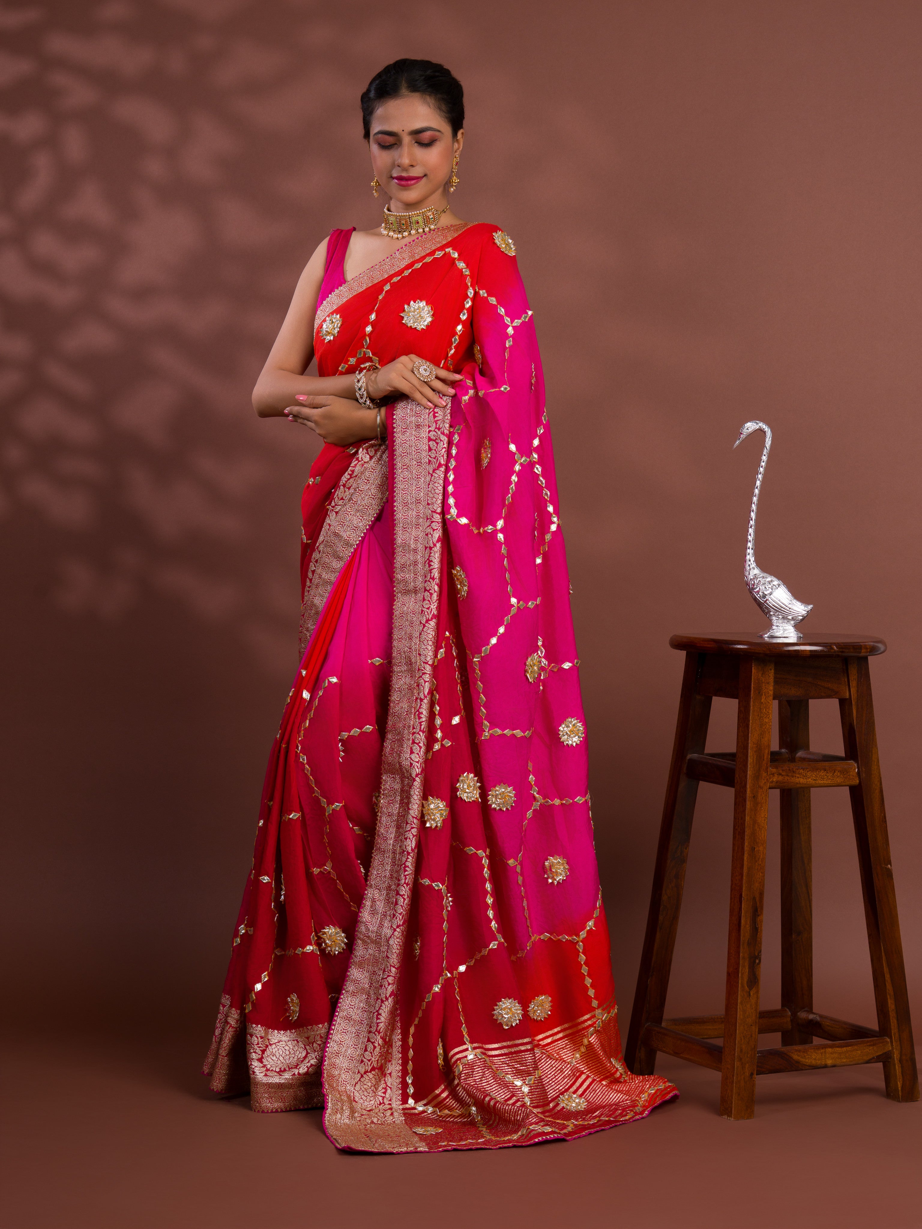 A pink and orange saree with Gota Patti Work