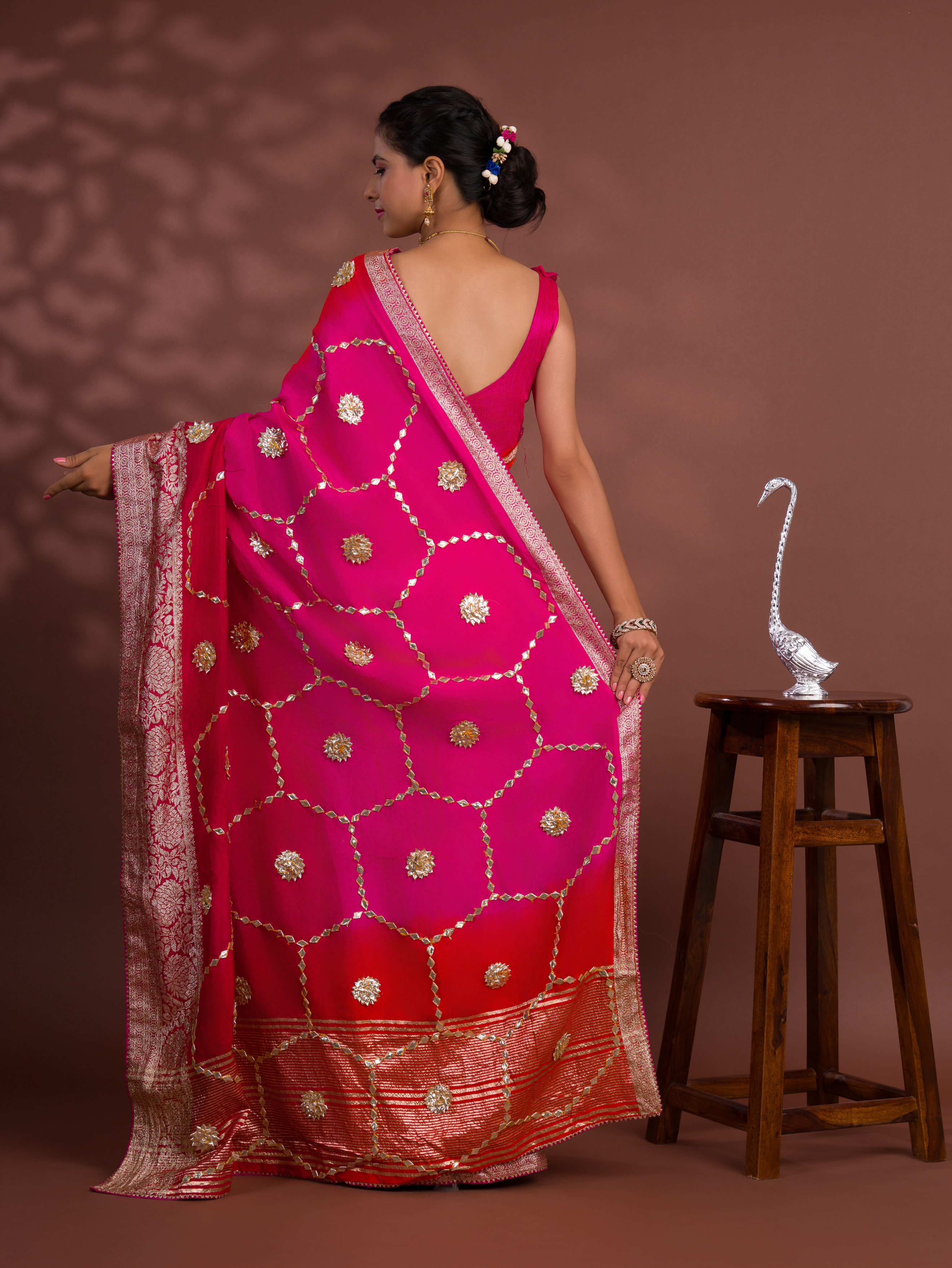 A pink and orange saree with Gota Patti Work