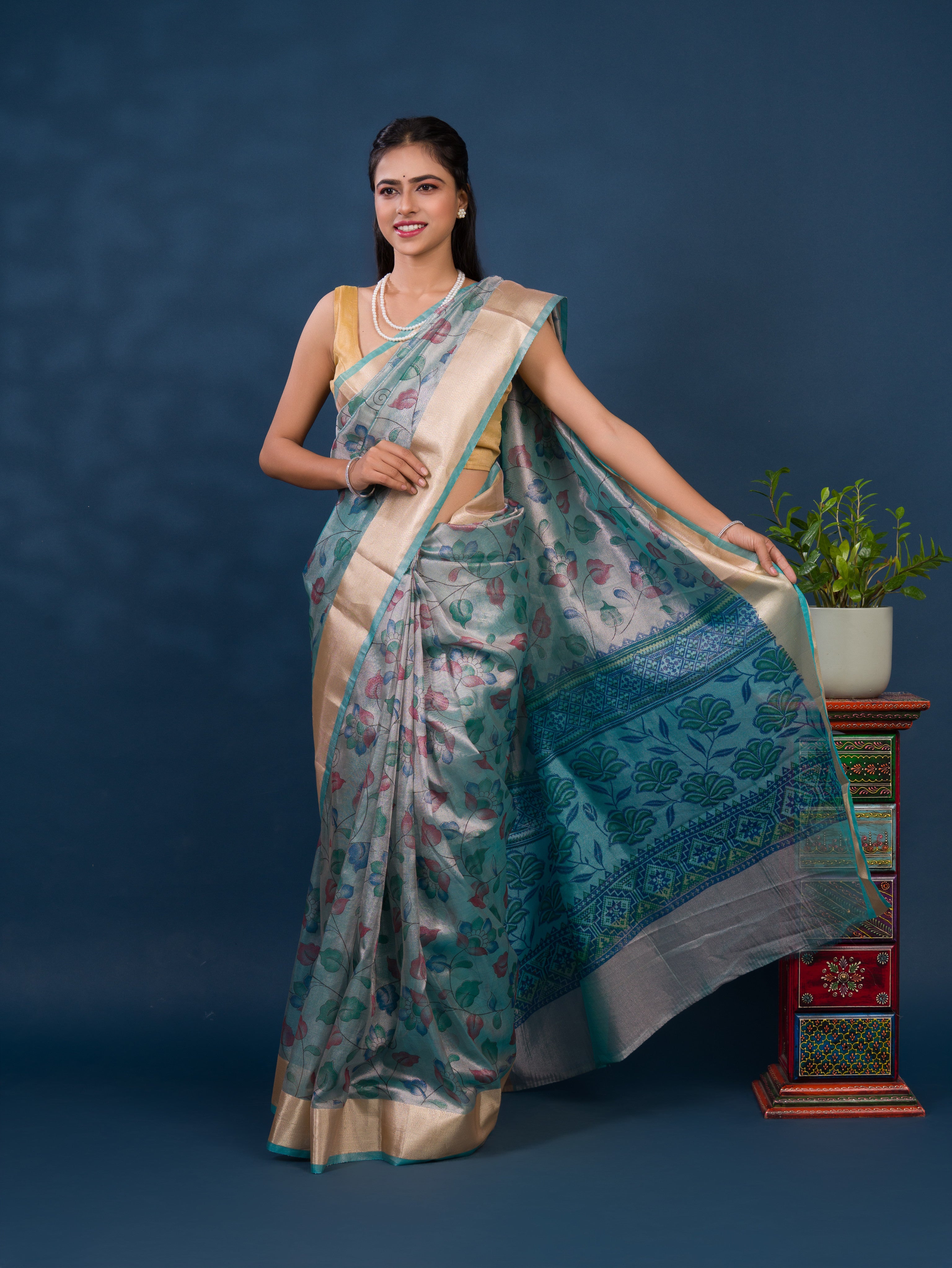 A traditional saree with Cotton Silk Printed With Zari border .