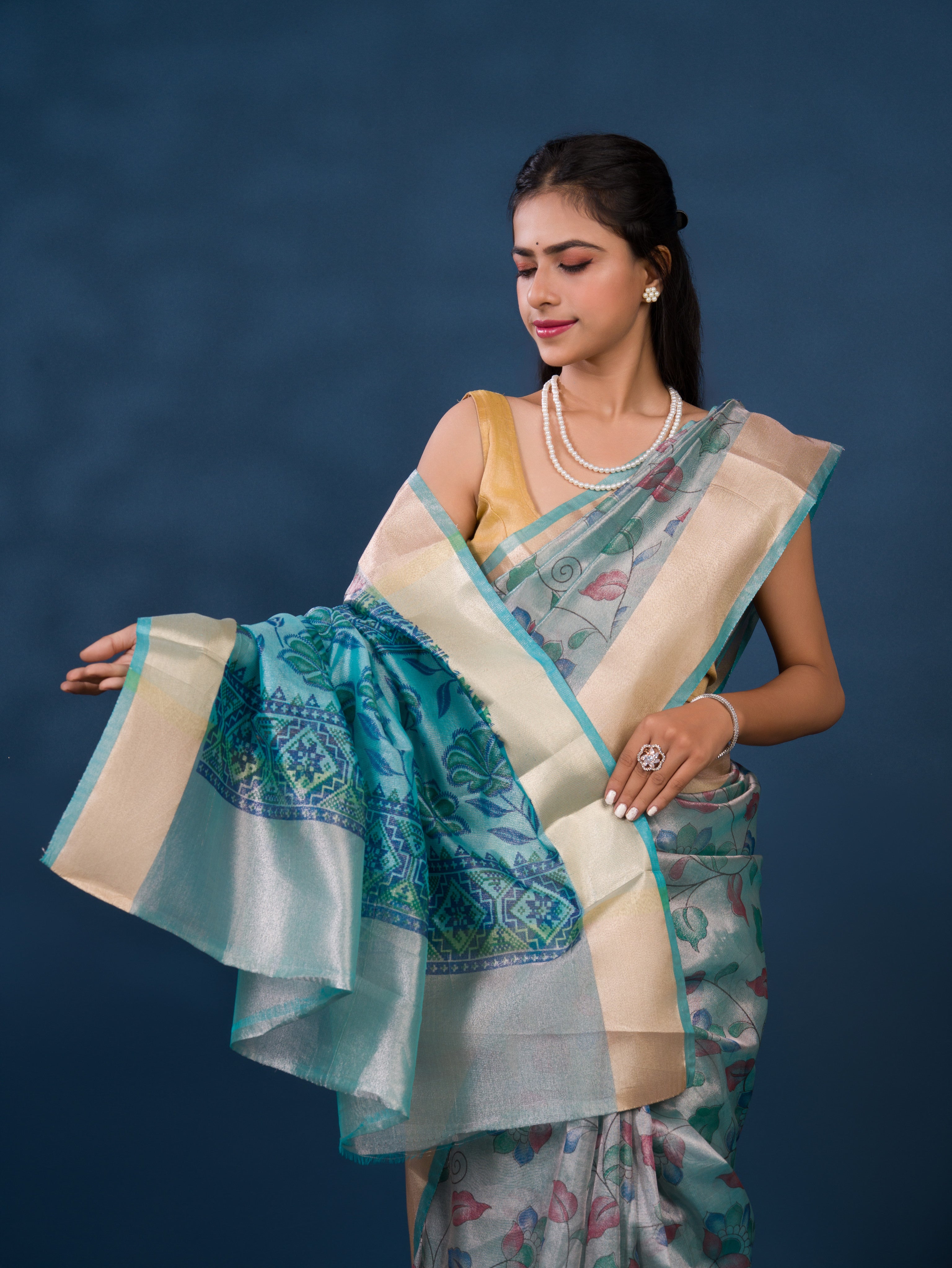 A traditional saree with Cotton Silk Printed With Zari border .