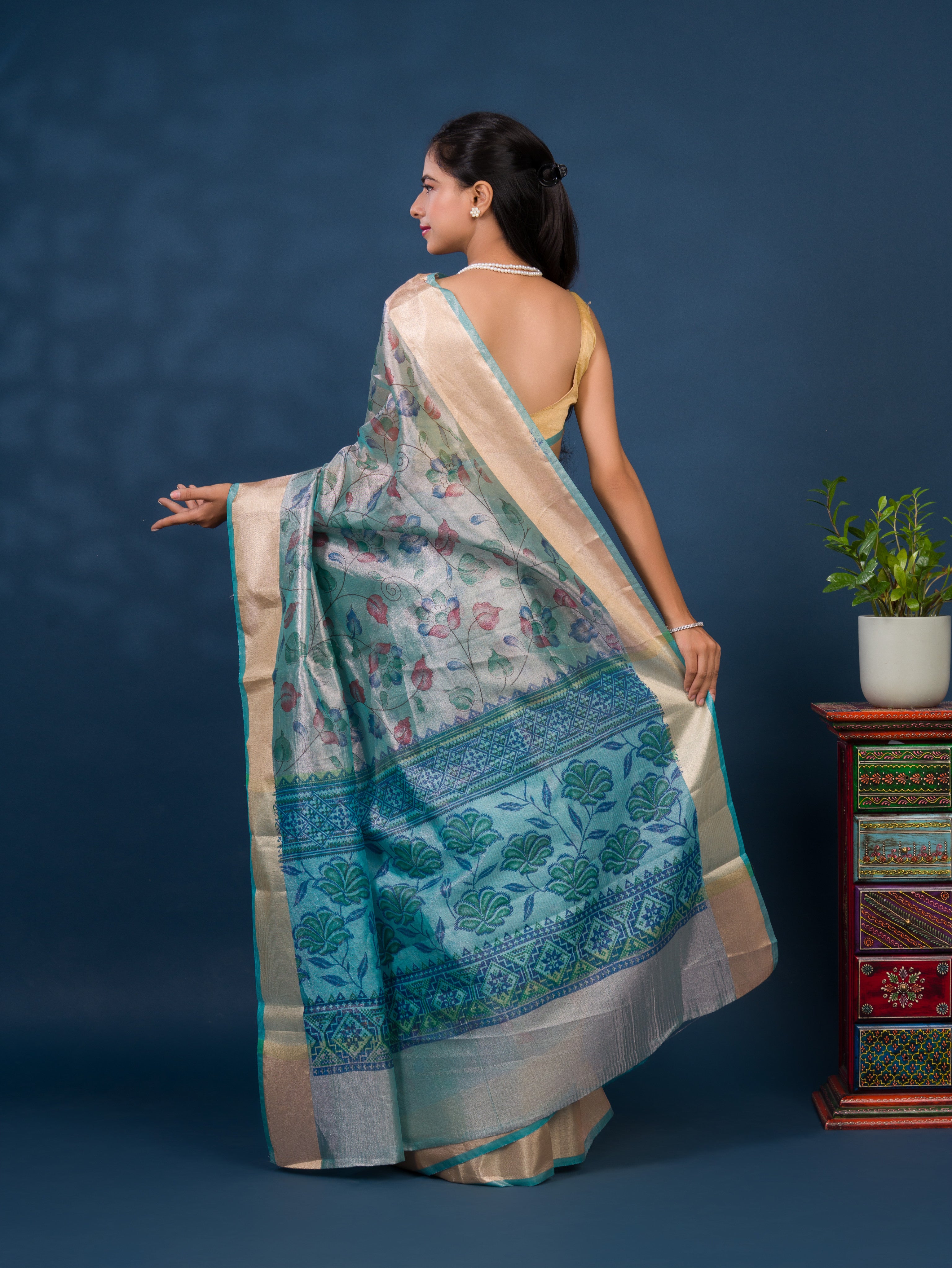 A traditional saree with Cotton Silk Printed With Zari border .