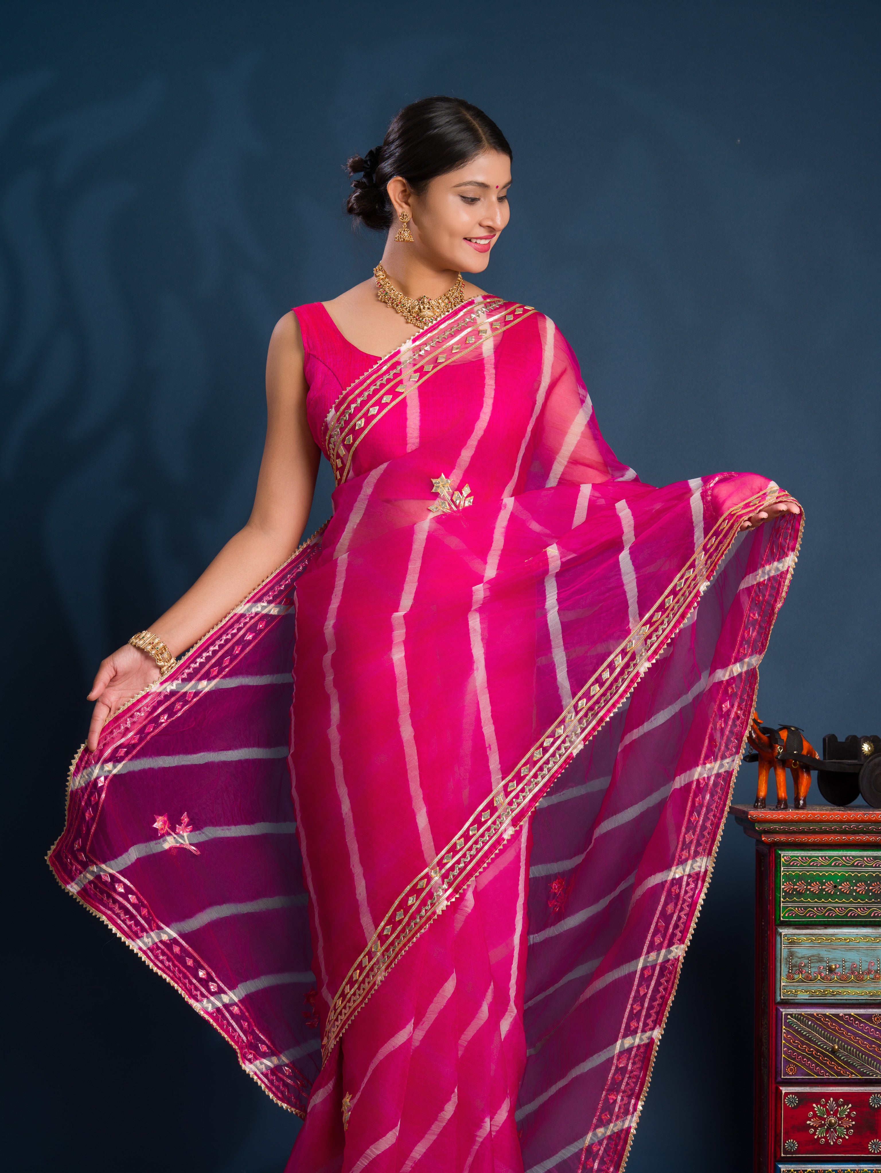 Pink saree with gold patternsOrganza Leheriya Style With Gotapatti Work