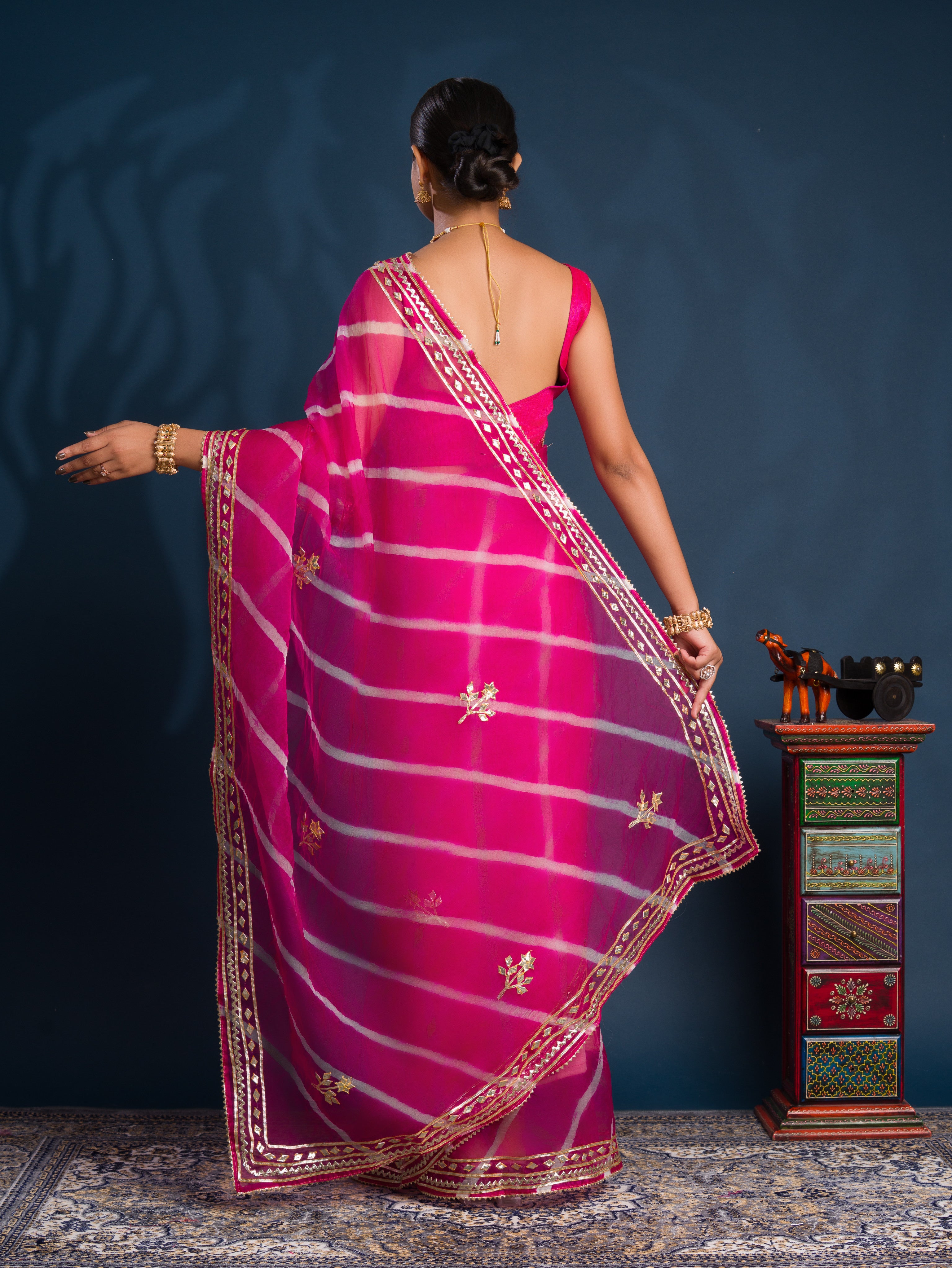 Pink saree with gold patternsOrganza Leheriya Style With Gotapatti Work