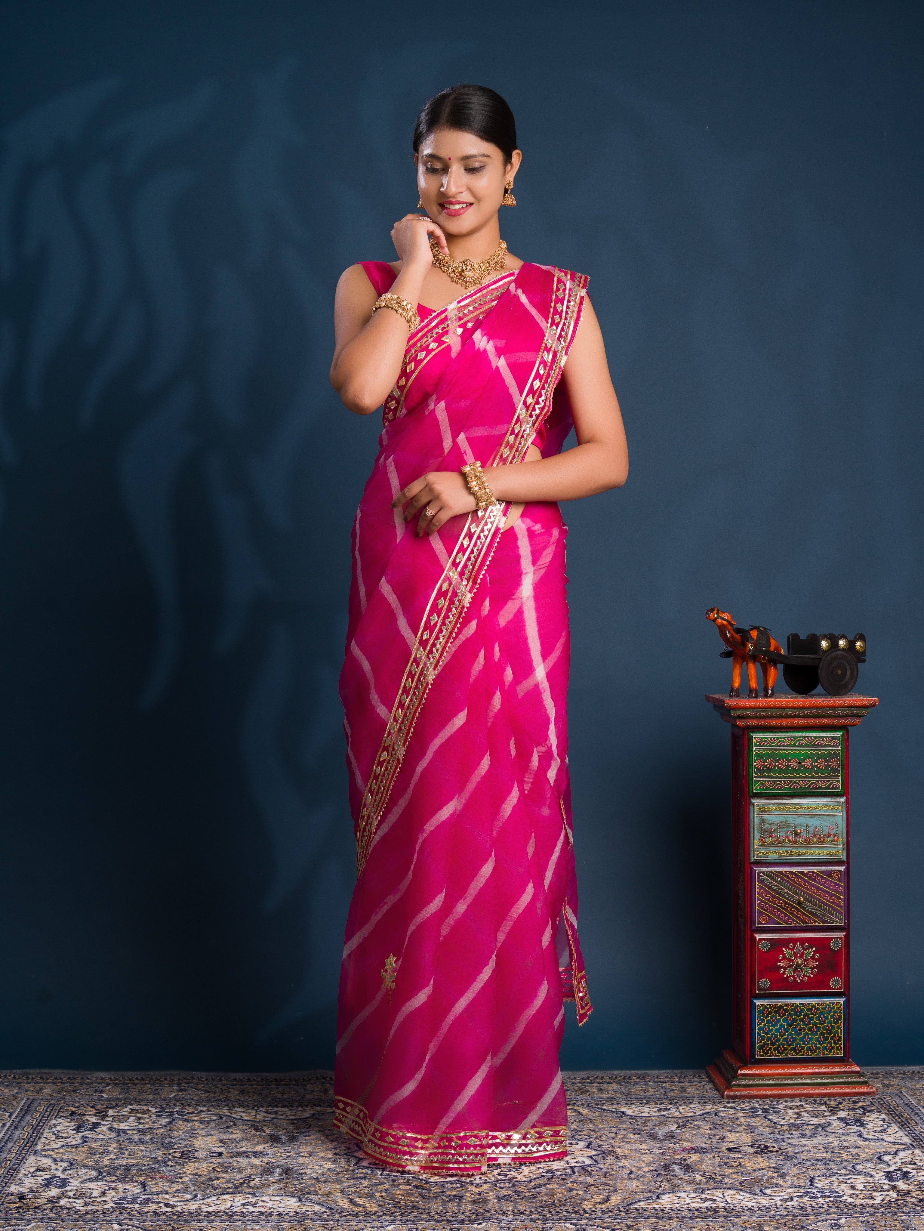 Pink saree with gold patternsOrganza Leheriya Style With Gotapatti Work