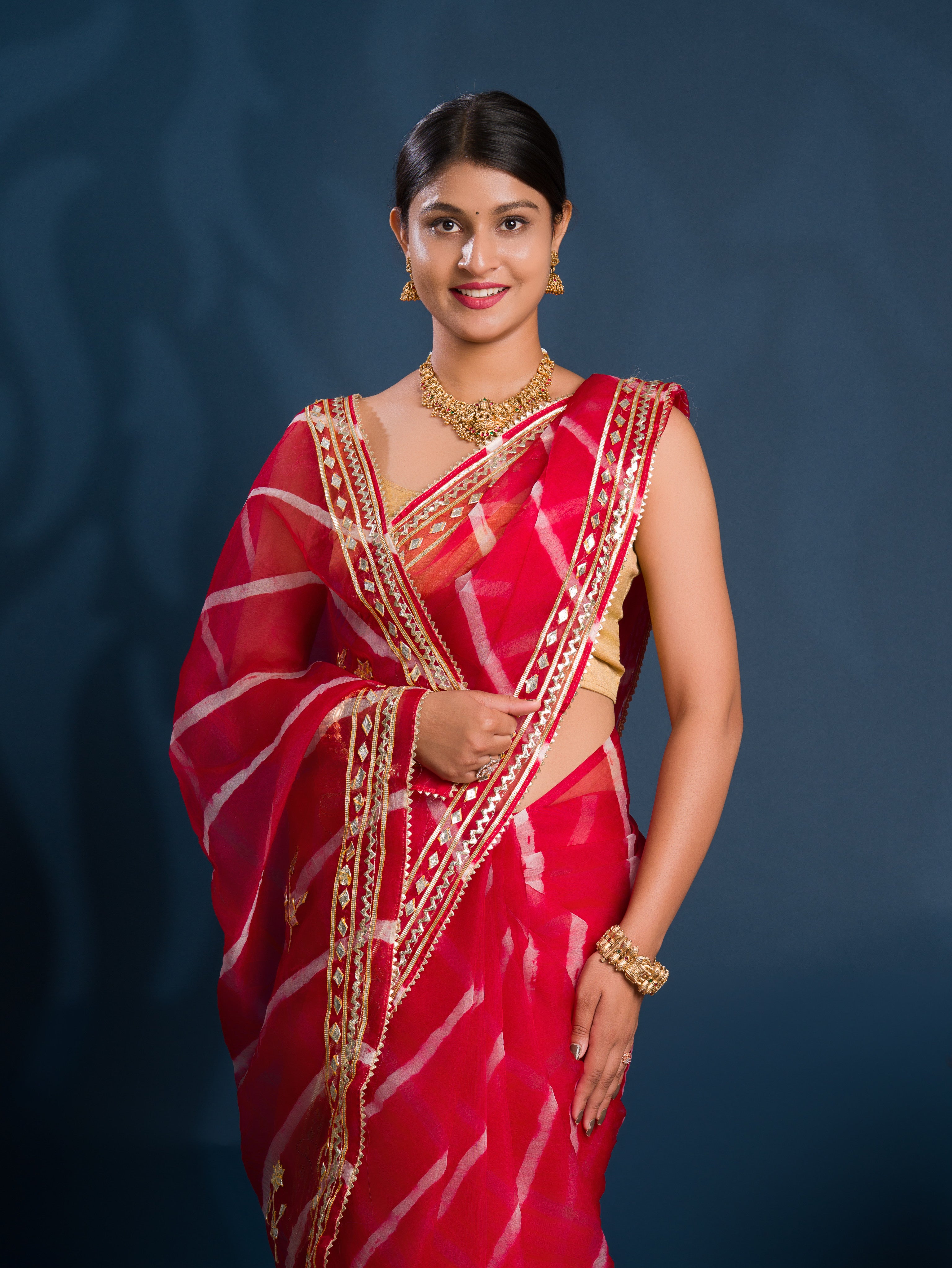 Red saree with gold patterns Organza Leheriya Style With Gotapatti Work
