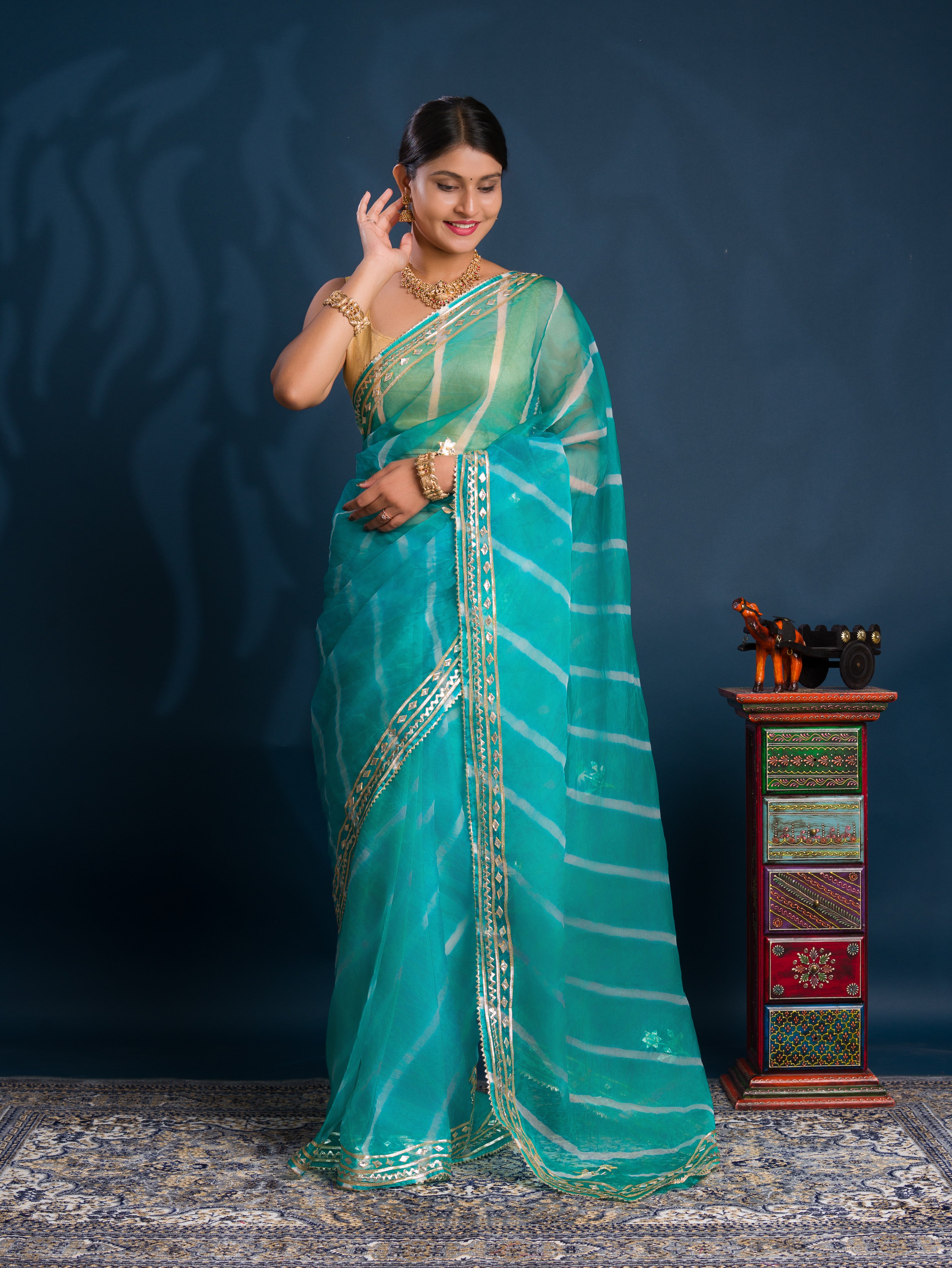 Teal sareewith Silverpatterns Organza Leheriya Style With Gotapatti Work