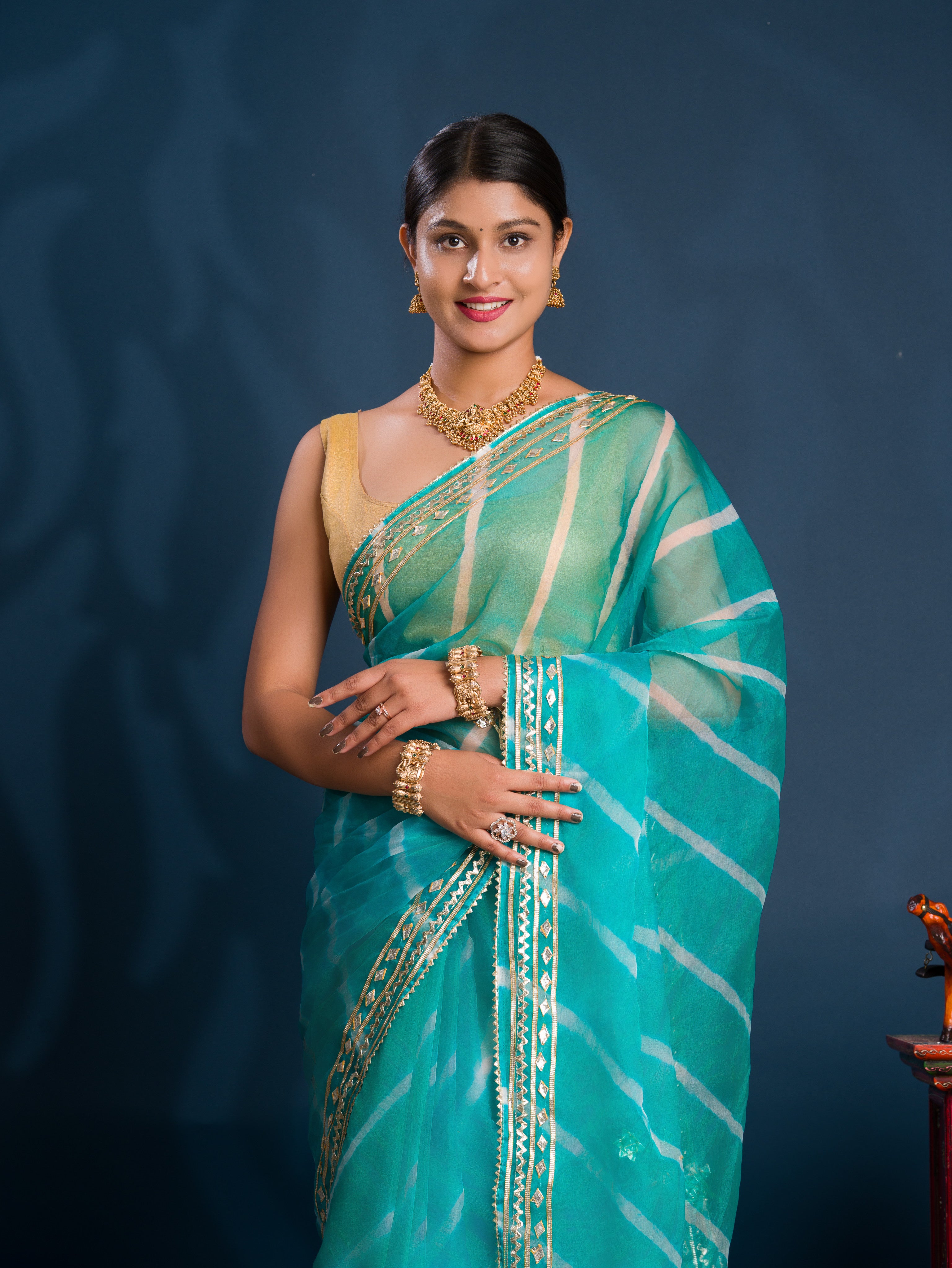 Teal sareewith Silverpatterns Organza Leheriya Style With Gotapatti Work