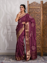 A wine and gold Upada silk saree with Bandhani style