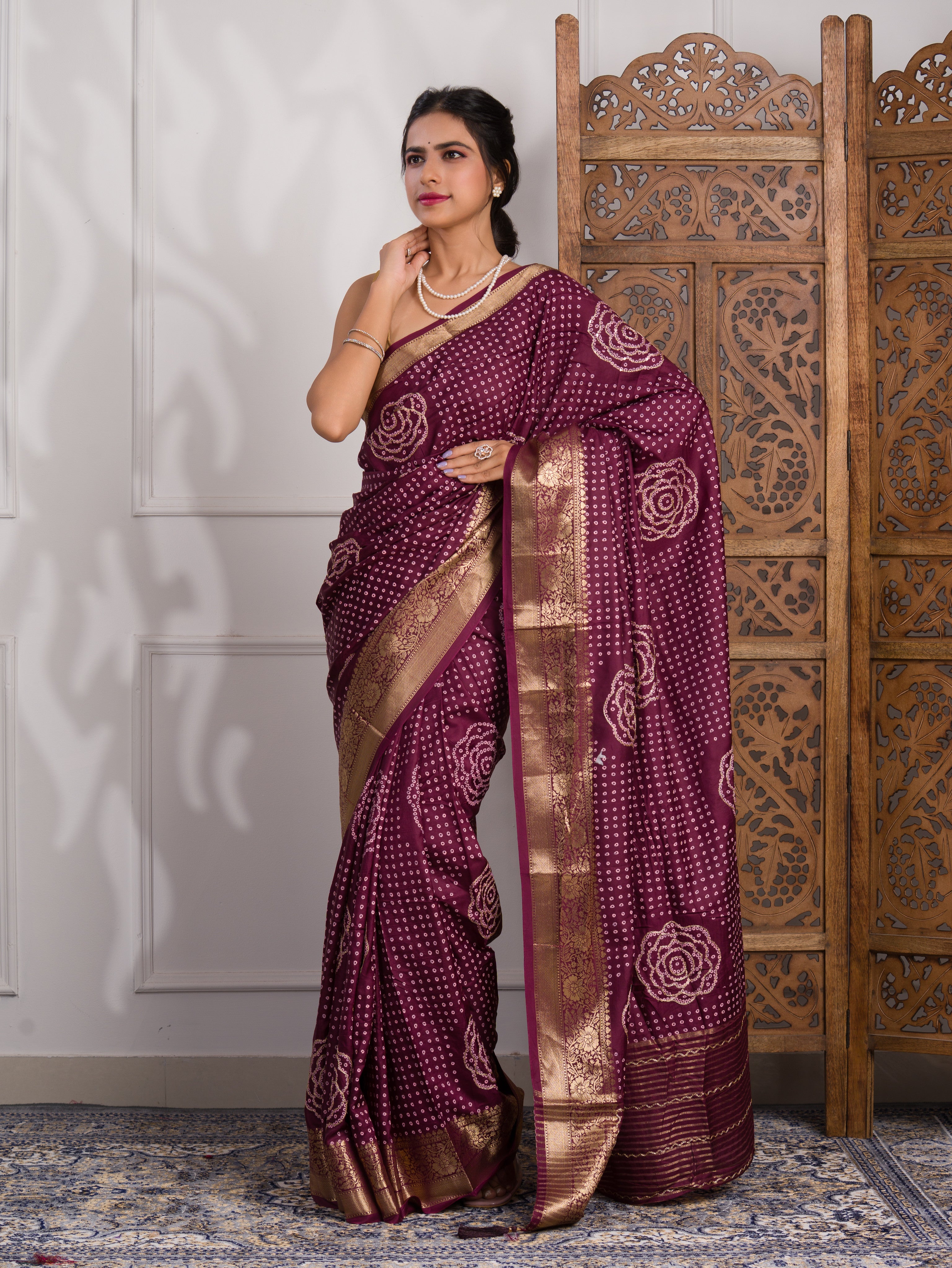 A wine and gold Upada silk saree with Bandhani style