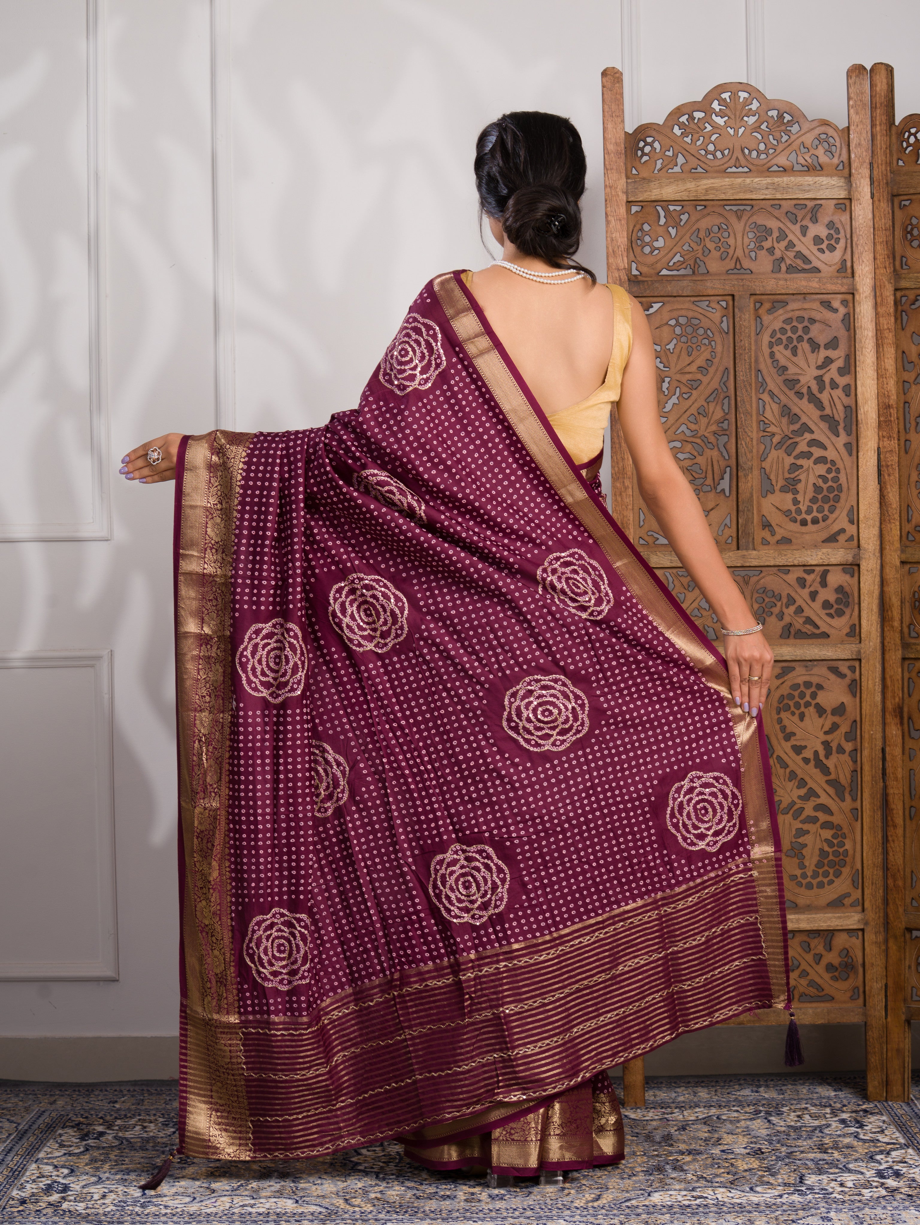 A wine and gold Upada silk saree with Bandhani style