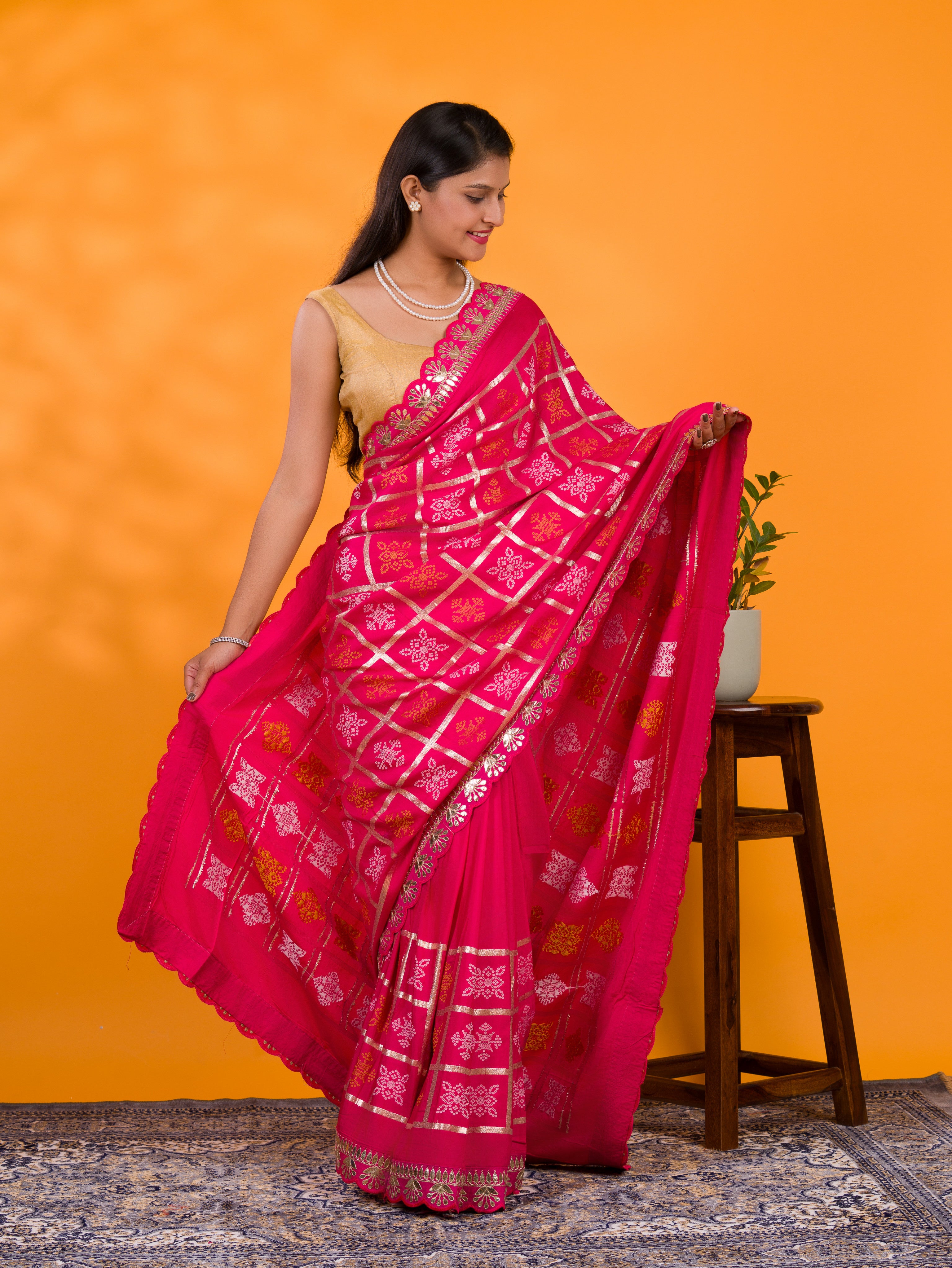 A pink saree with white patterns withCotton silk Bandhani Gotapatti Work Saree