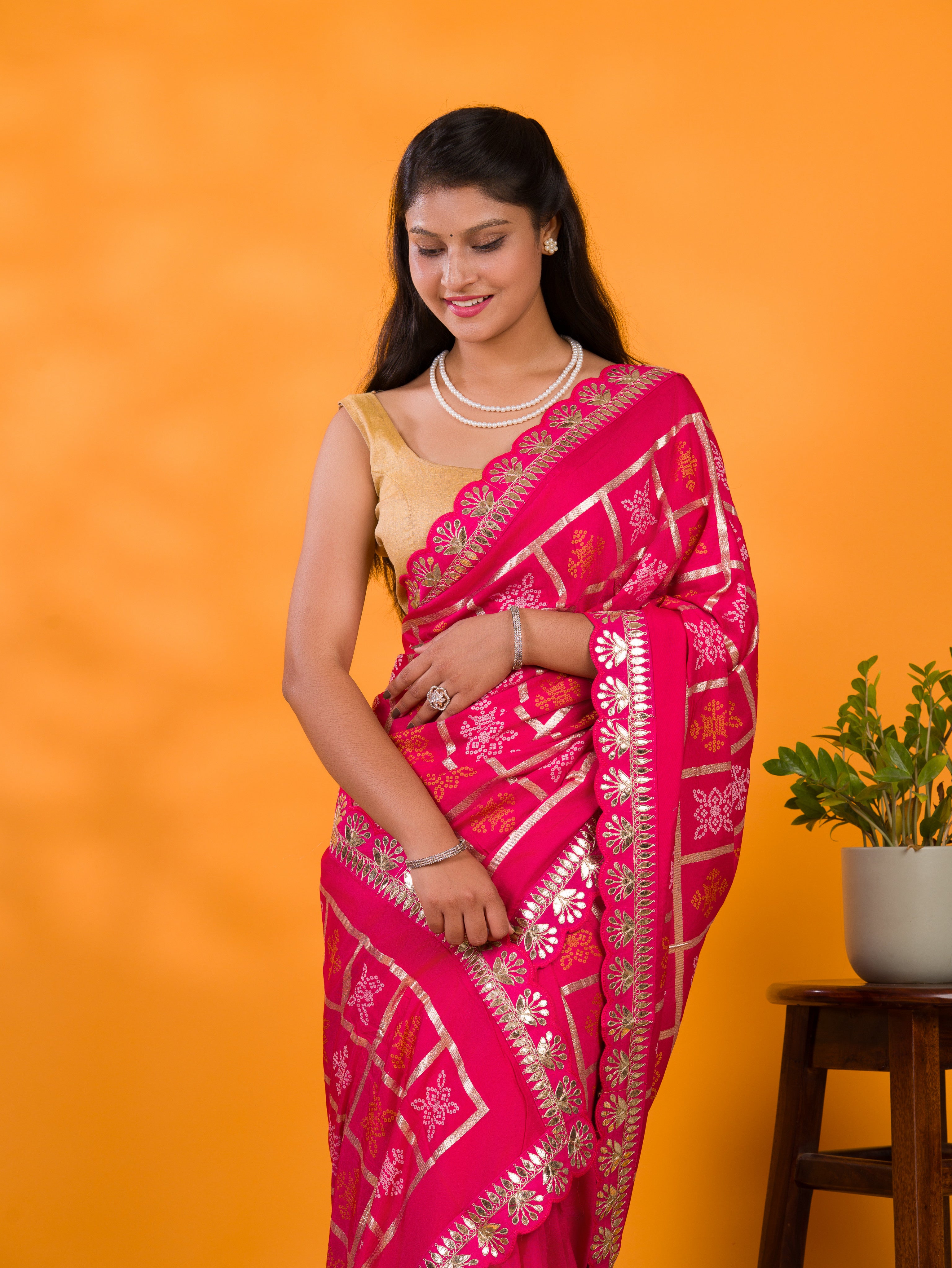 A pink saree with white patterns withCotton silk Bandhani Gotapatti Work Saree