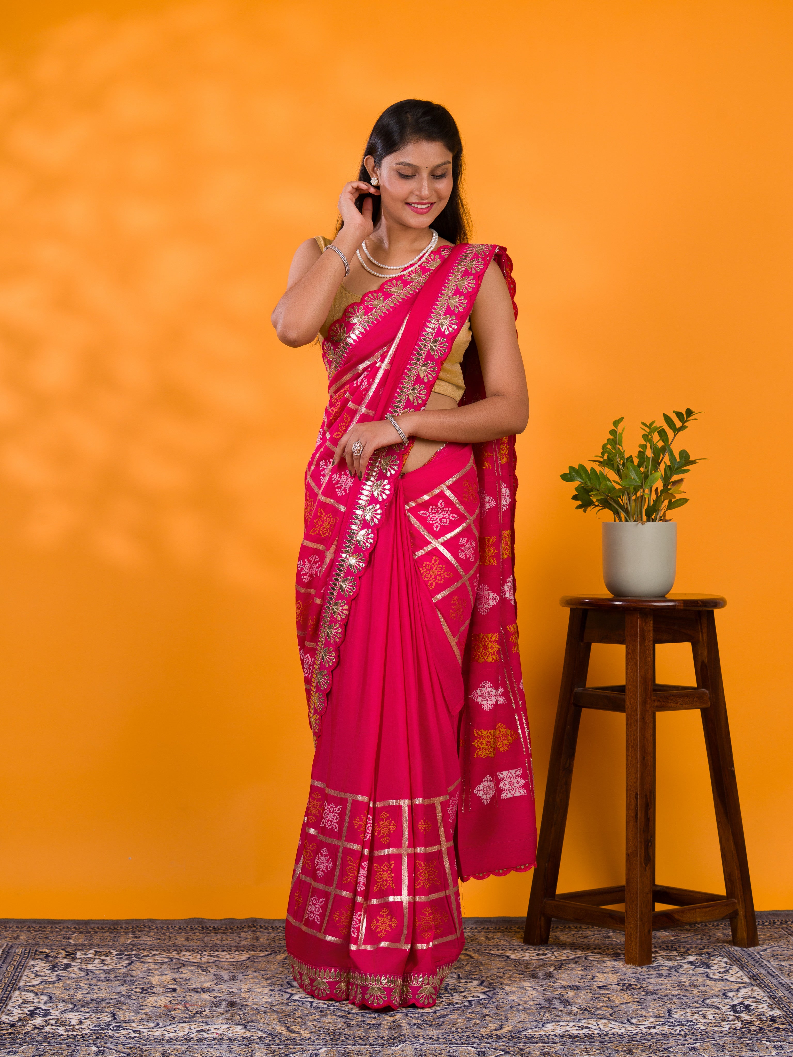 A pink saree with white patterns withCotton silk Bandhani Gotapatti Work Saree