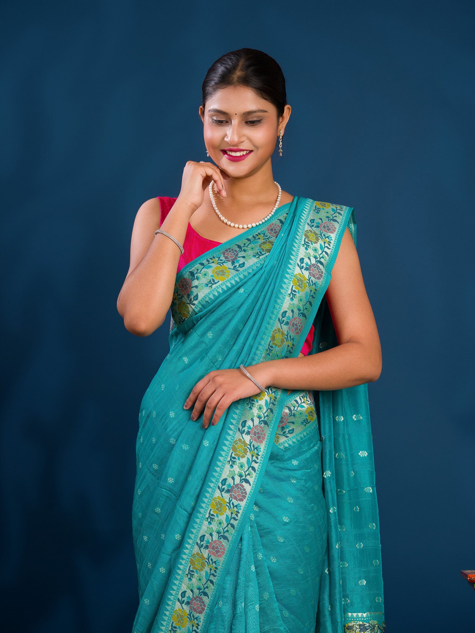A teal saree with floral patternsBanarasi Silk Printed Style With zari weaving Work Saree