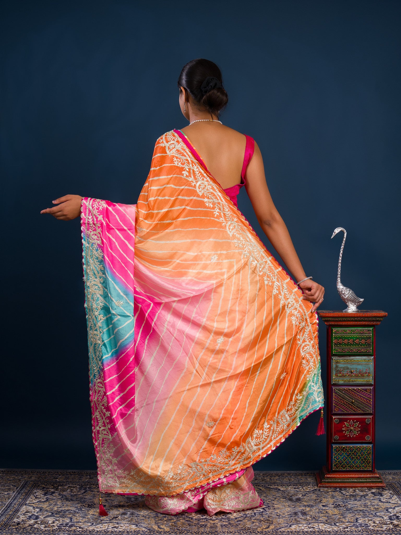 Acolorful saree in leheriya style