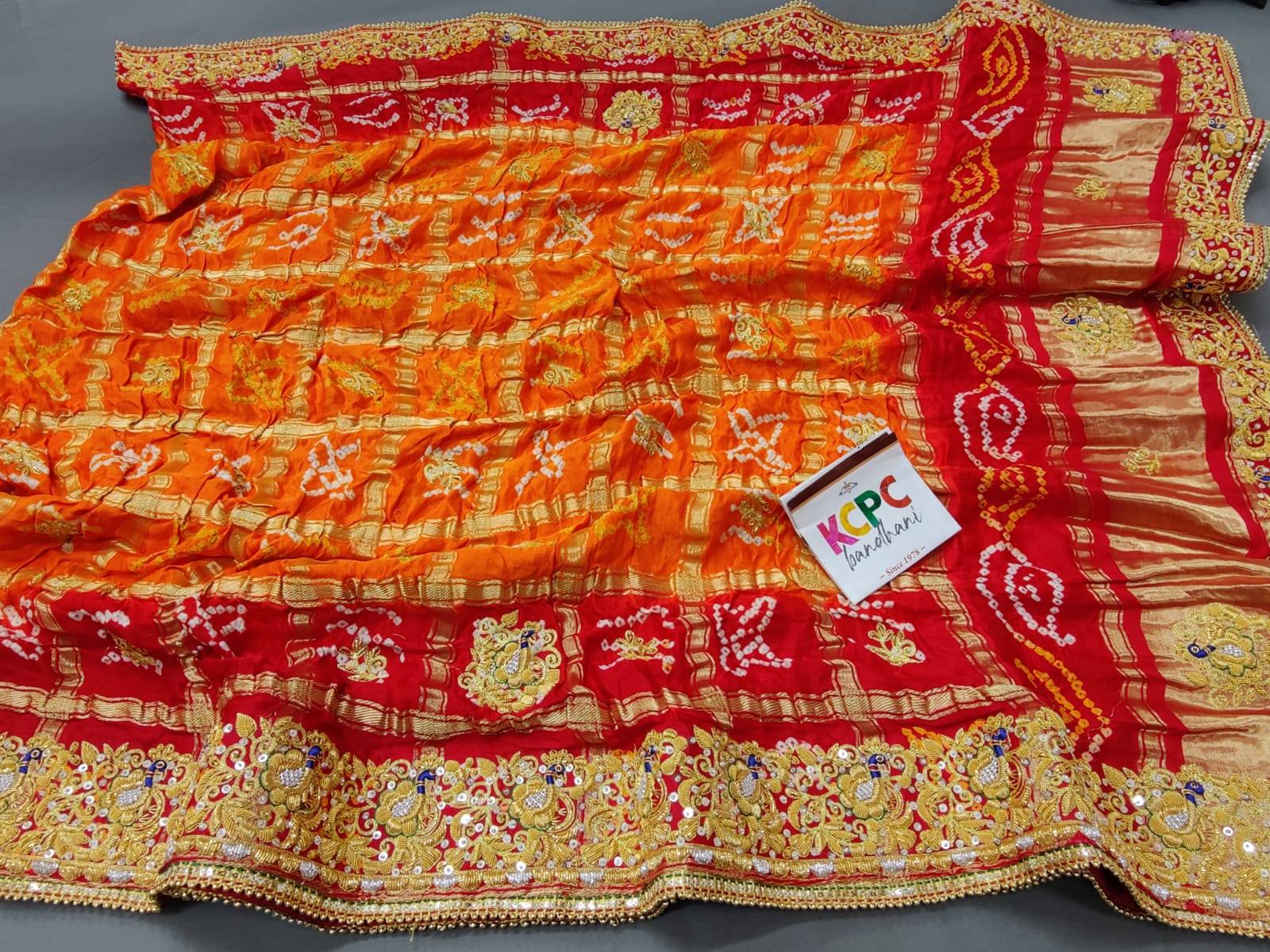 KcPc Trending Pure Gaji Silk Bandhani Jardozi Work Ghatchola Odhna in Aara Tari Handwork Pila (Red Orange)
