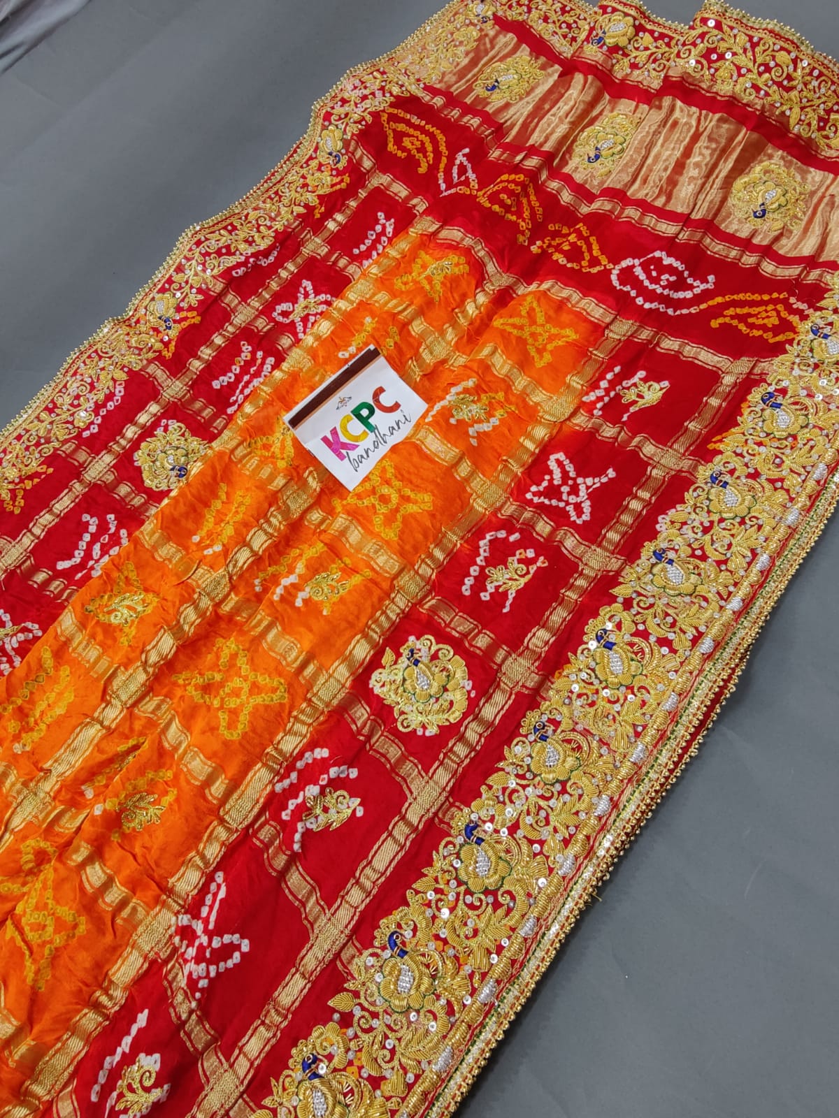 KcPc Trending Pure Gaji Silk Bandhani Jardozi Work Ghatchola Odhna in Aara Tari Handwork Pila (Red Orange)