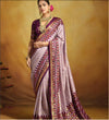A purple and pink Banarasi silk saree