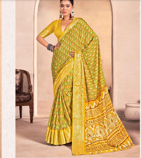 A yellow and green georgette saree with floralhand print work.
