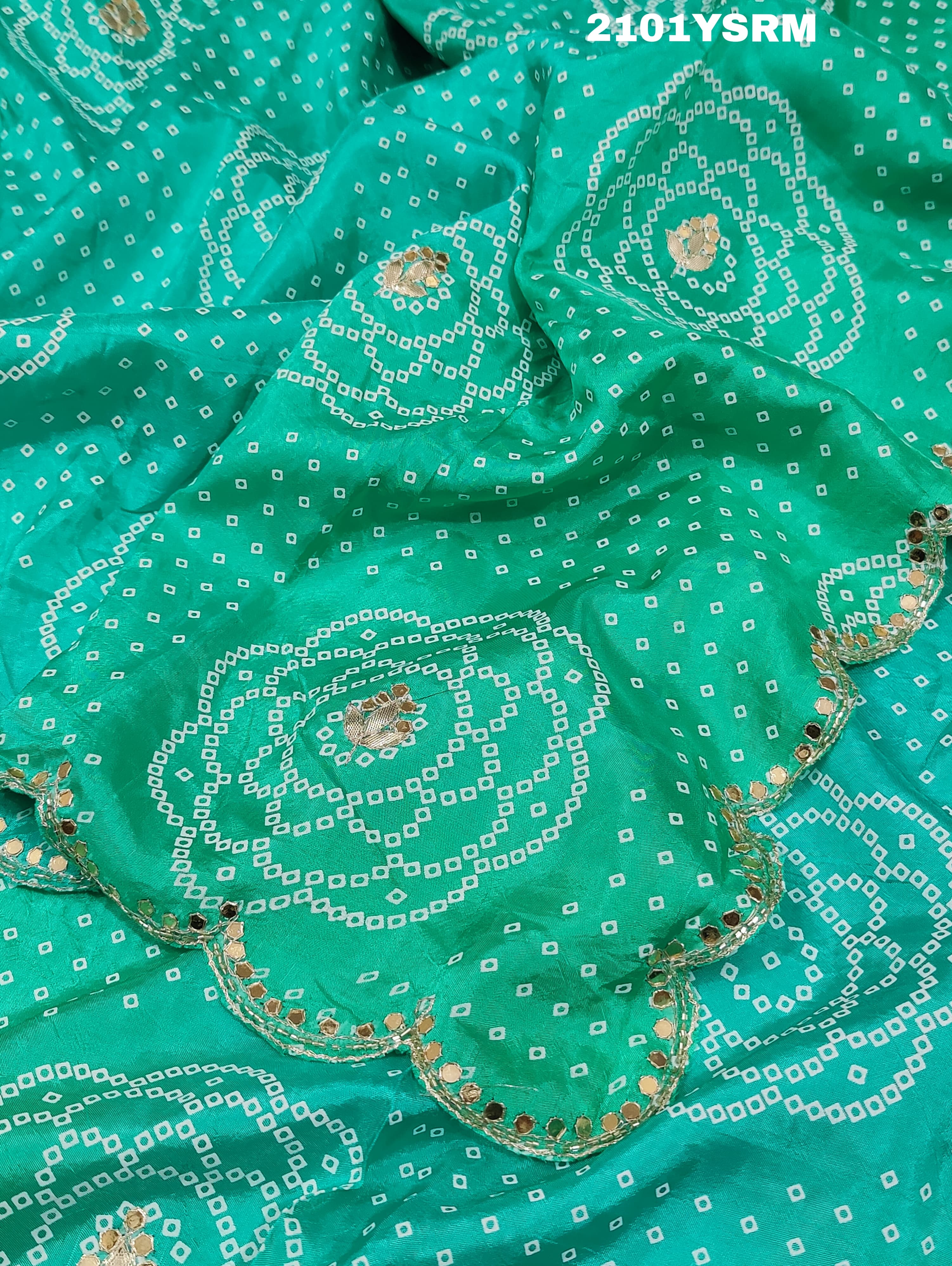 A green modal silk bandhani saree with pitan gotapatti work