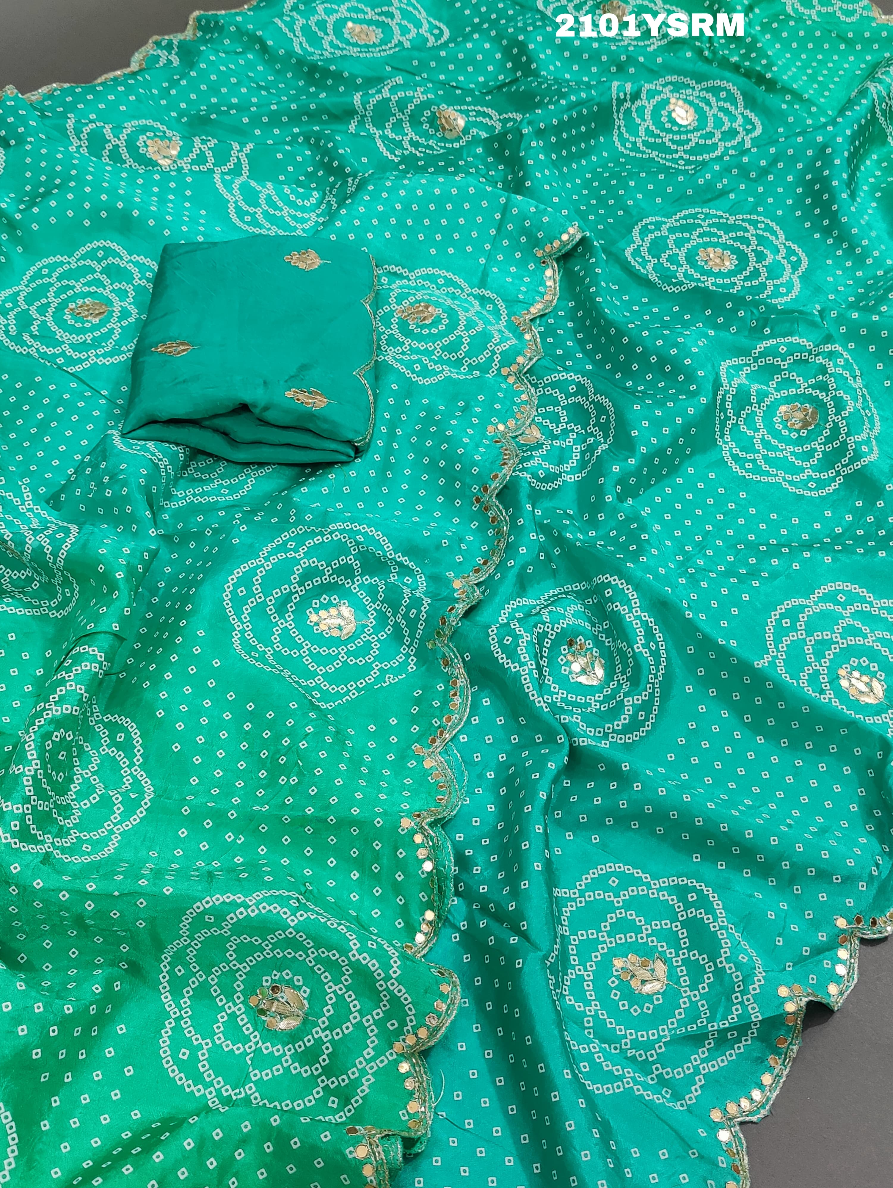 A green modal silk bandhani saree with pitan gotapatti work