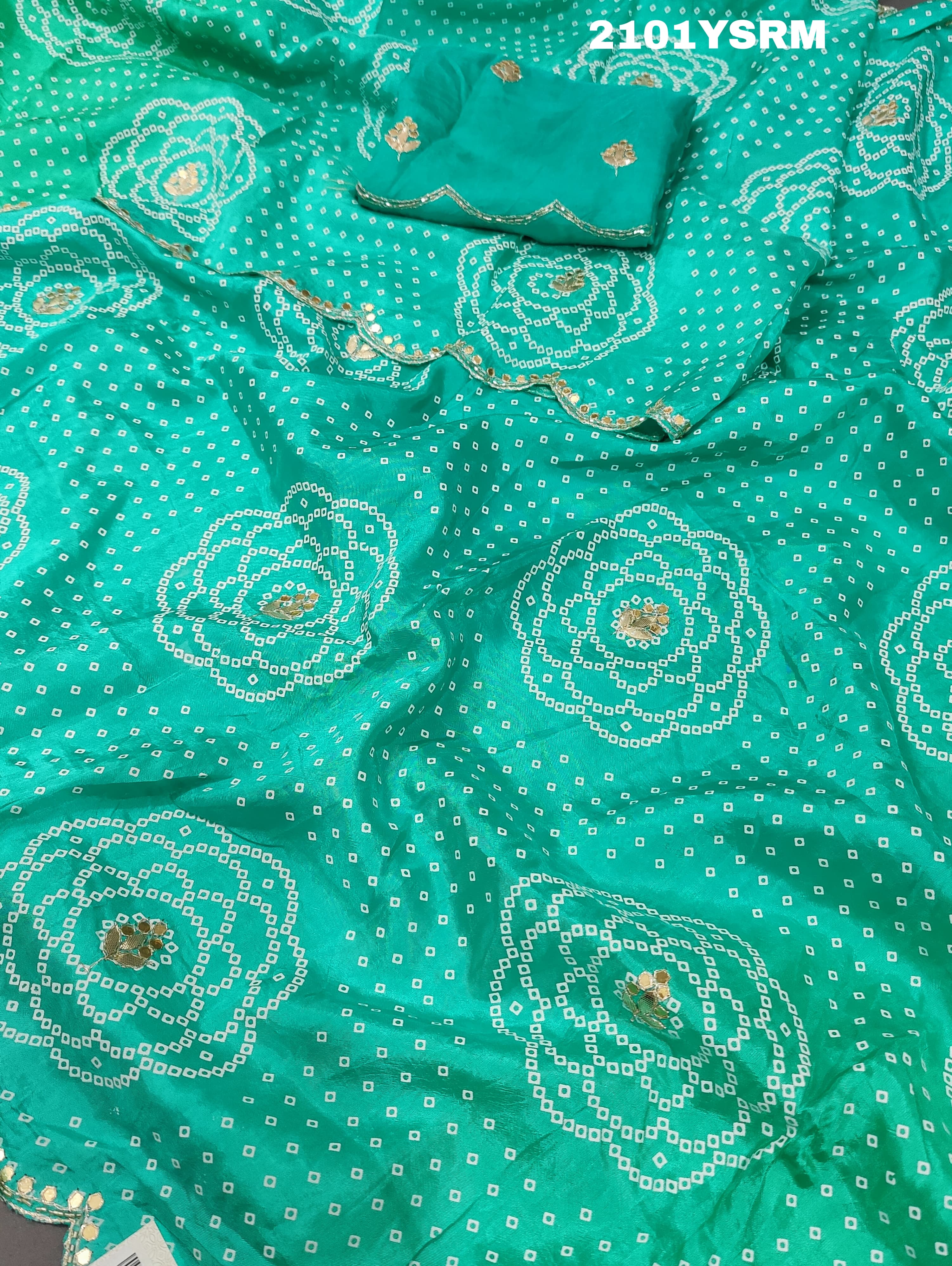 A green modal silk bandhani saree with pitan gotapatti work