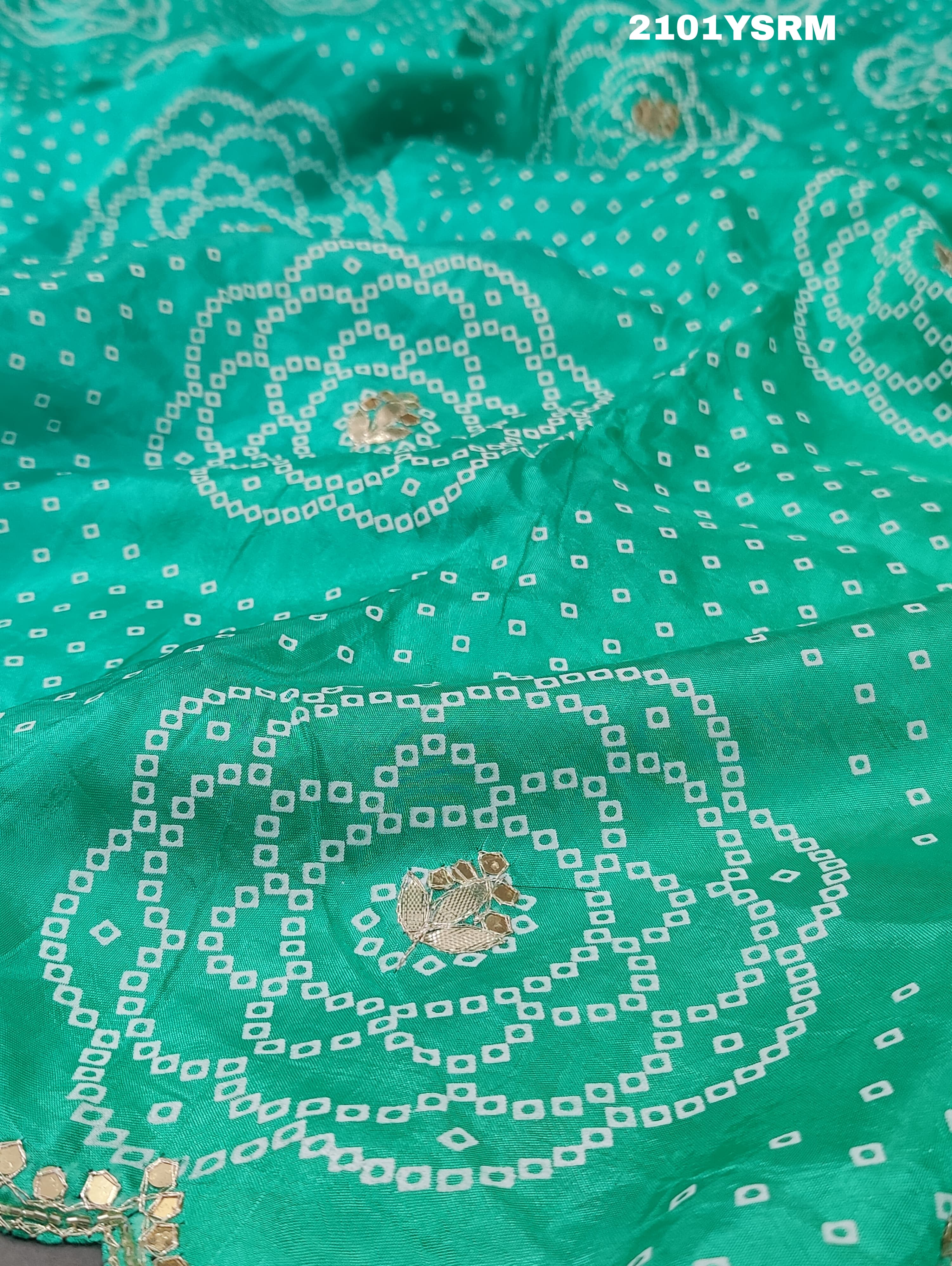 A green modal silk bandhani saree with pitan gotapatti work