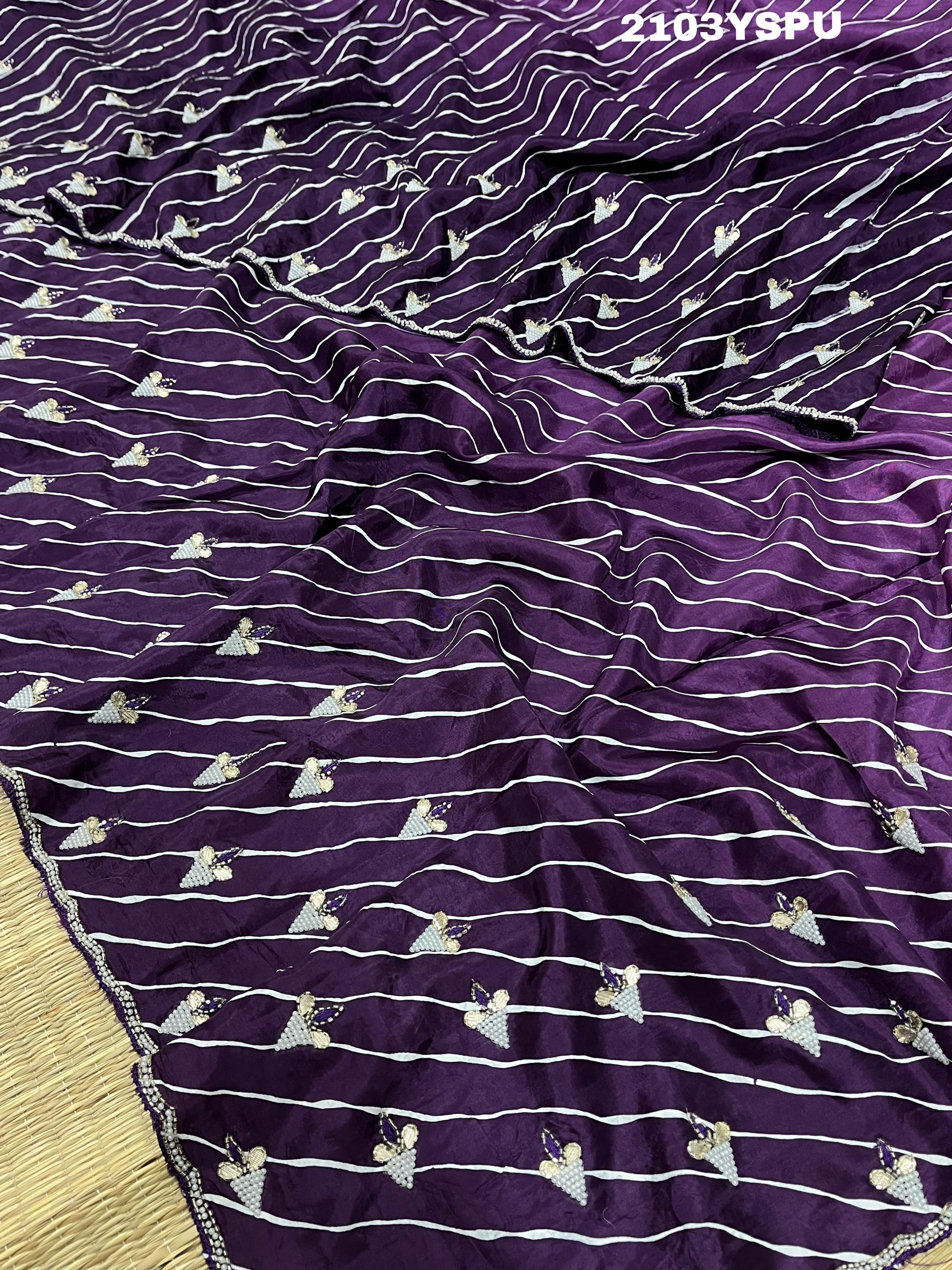 A purple dola silk saree with pearl gotapatti work