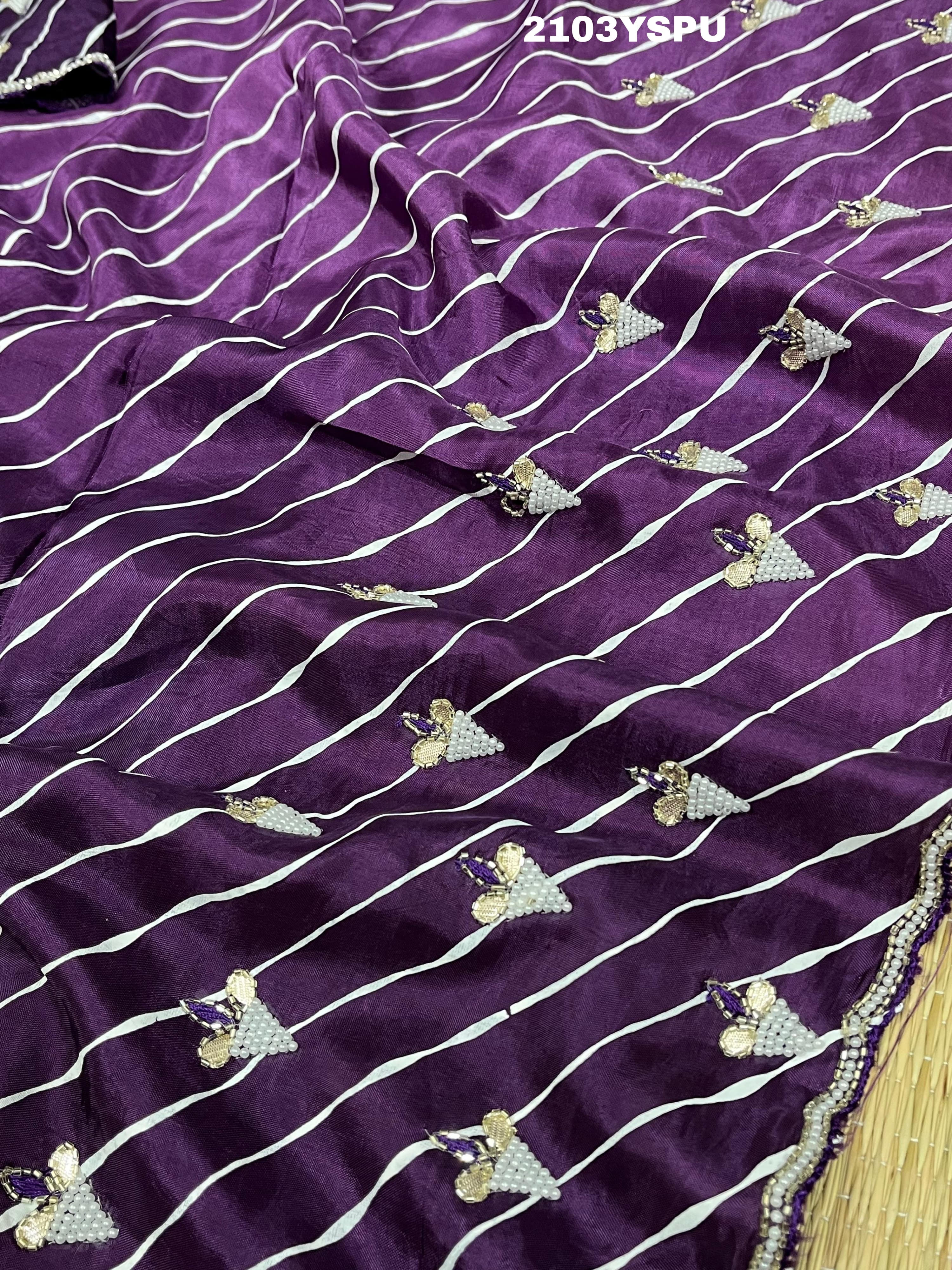 A purple dola silk saree with pearl gotapatti work